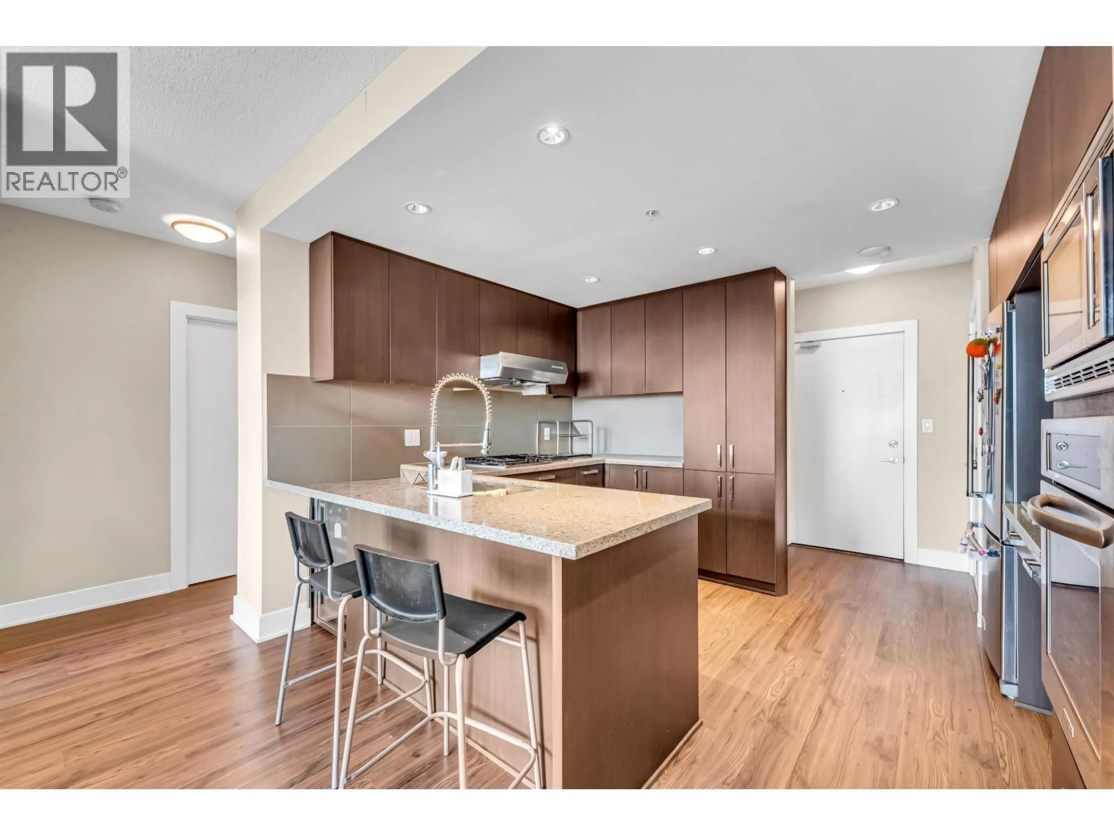 Open concept kitchen, wood/laminate floor for 2809 - 1155 THE HIGH STREET, Coquitlam British Columbia V3B7W4