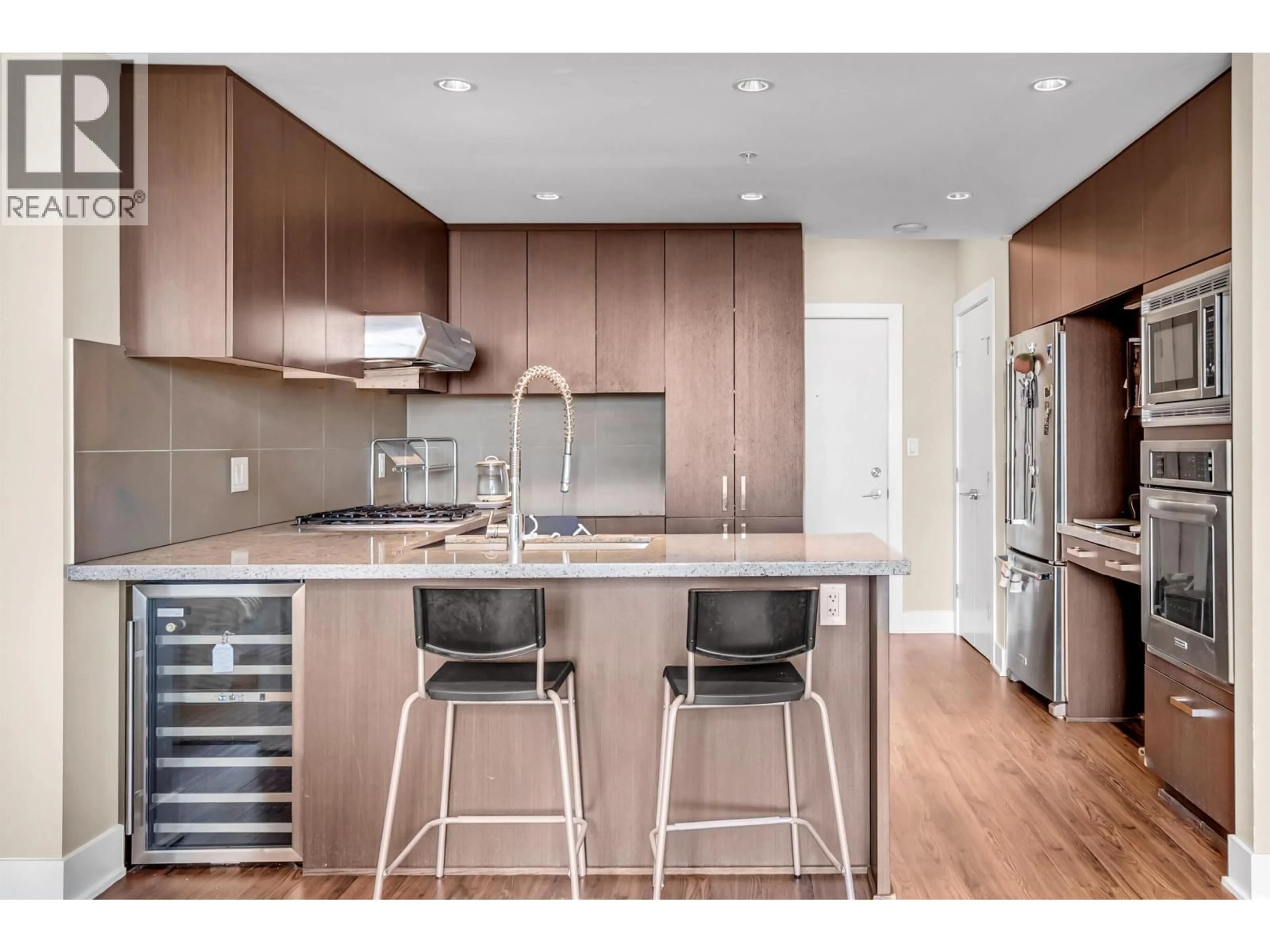 Open concept kitchen, wood/laminate floor for 2809 - 1155 THE HIGH STREET, Coquitlam British Columbia V3B7W4