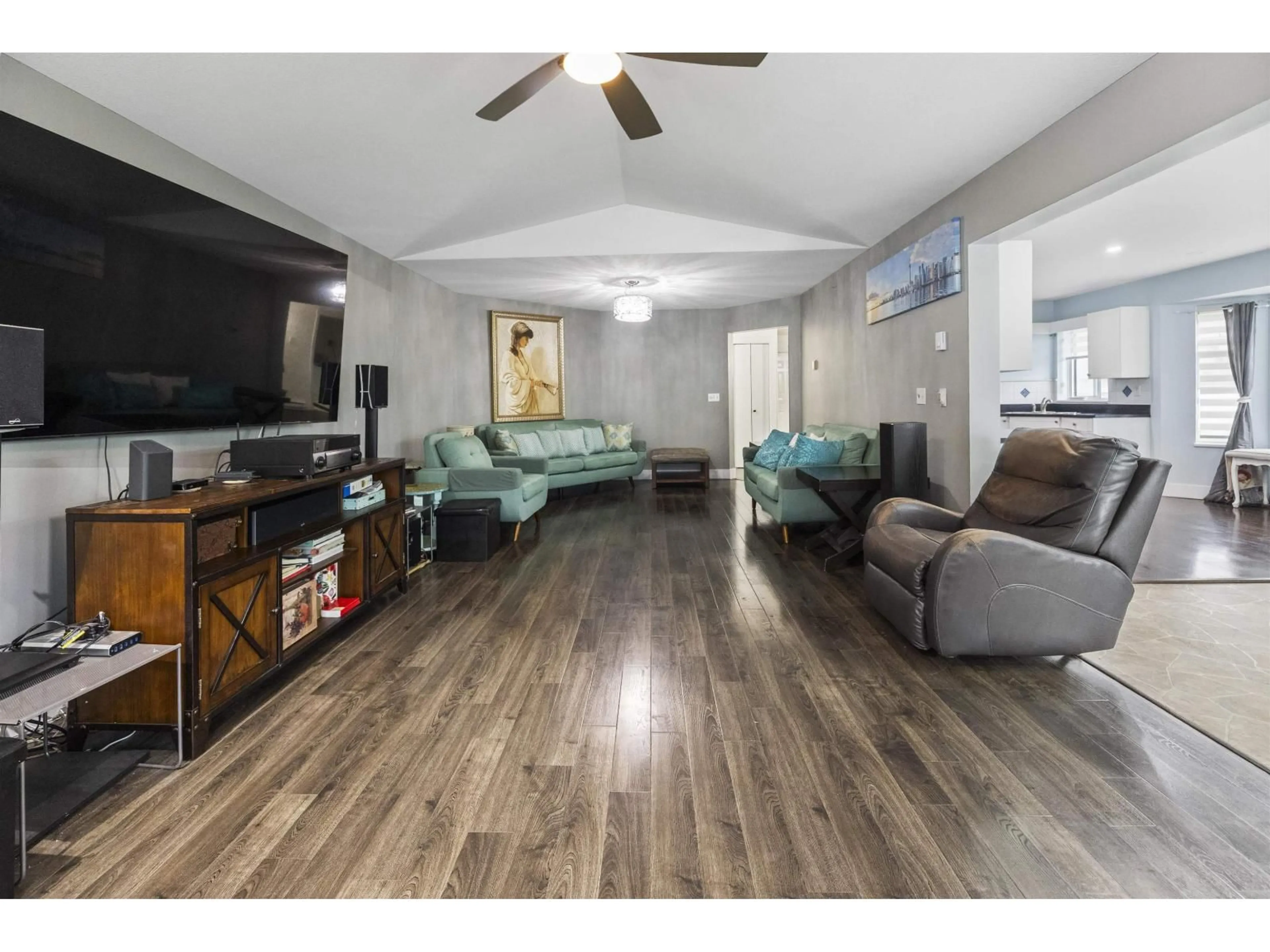 Living room with furniture, wood/laminate floor for 213 - 7156 121 STREET, Surrey British Columbia V3W0J6