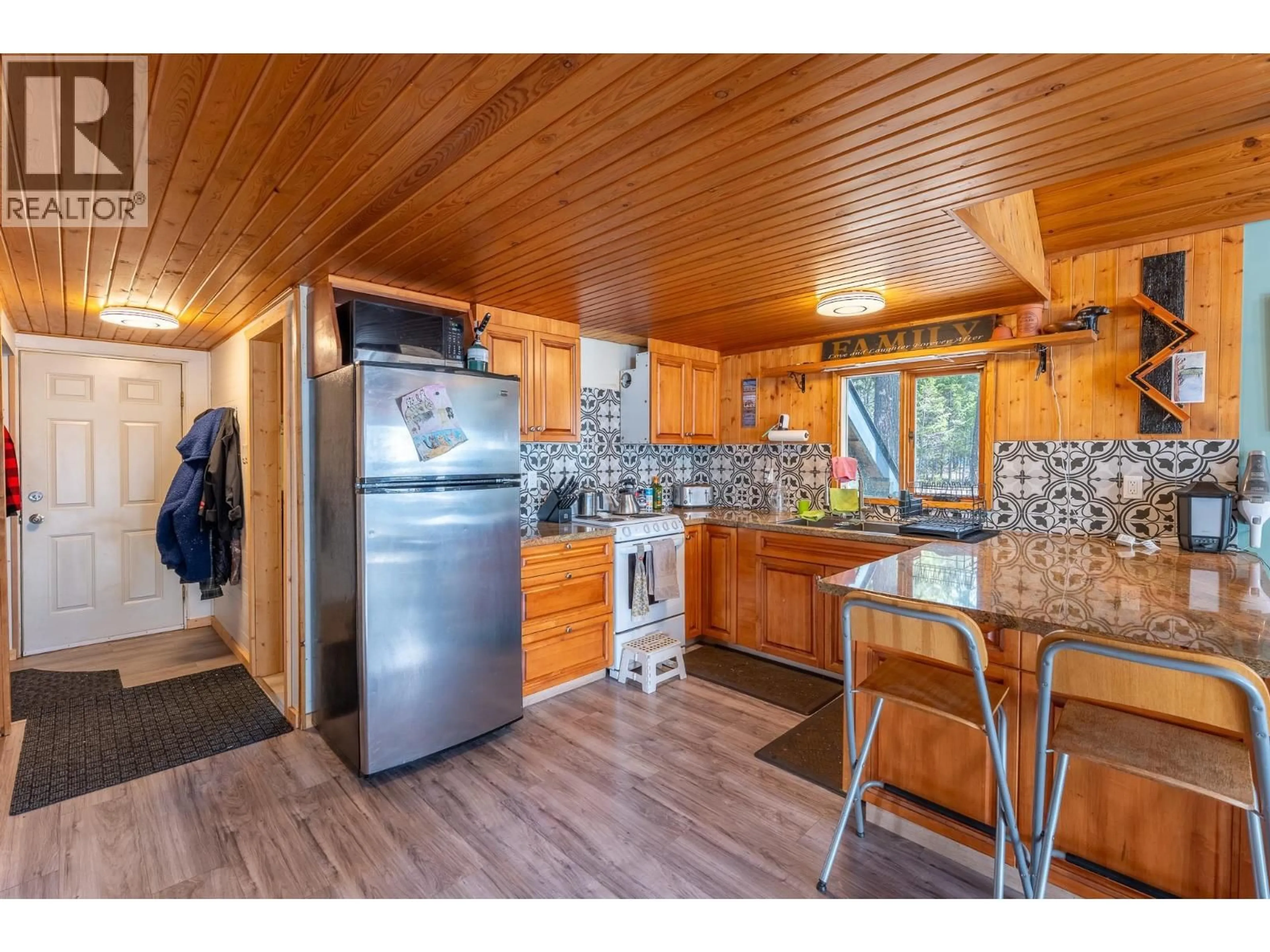 Open concept kitchen, wood/laminate floor for 3830 MEIER ROAD, Cluculz Lake British Columbia V0J3A3