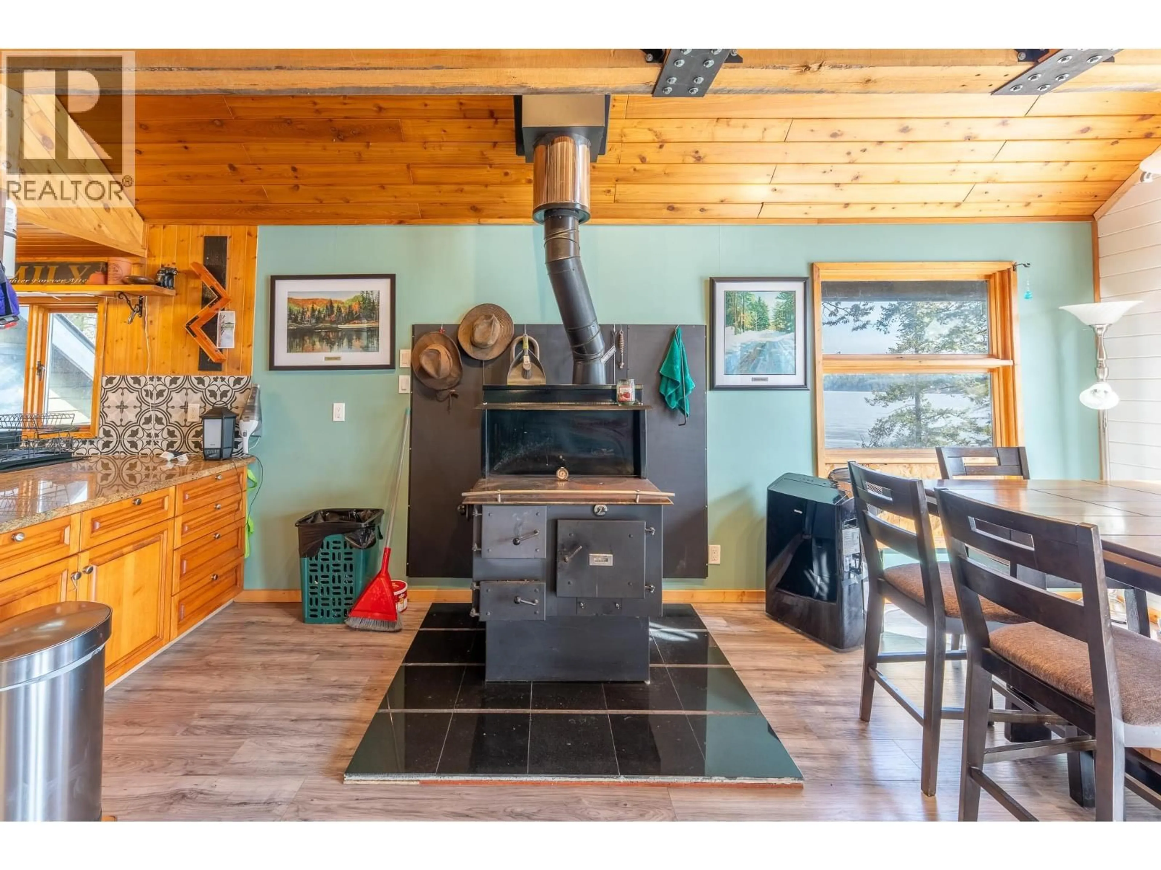 Open concept kitchen, wood/laminate floor for 3830 MEIER ROAD, Cluculz Lake British Columbia V0J3A3