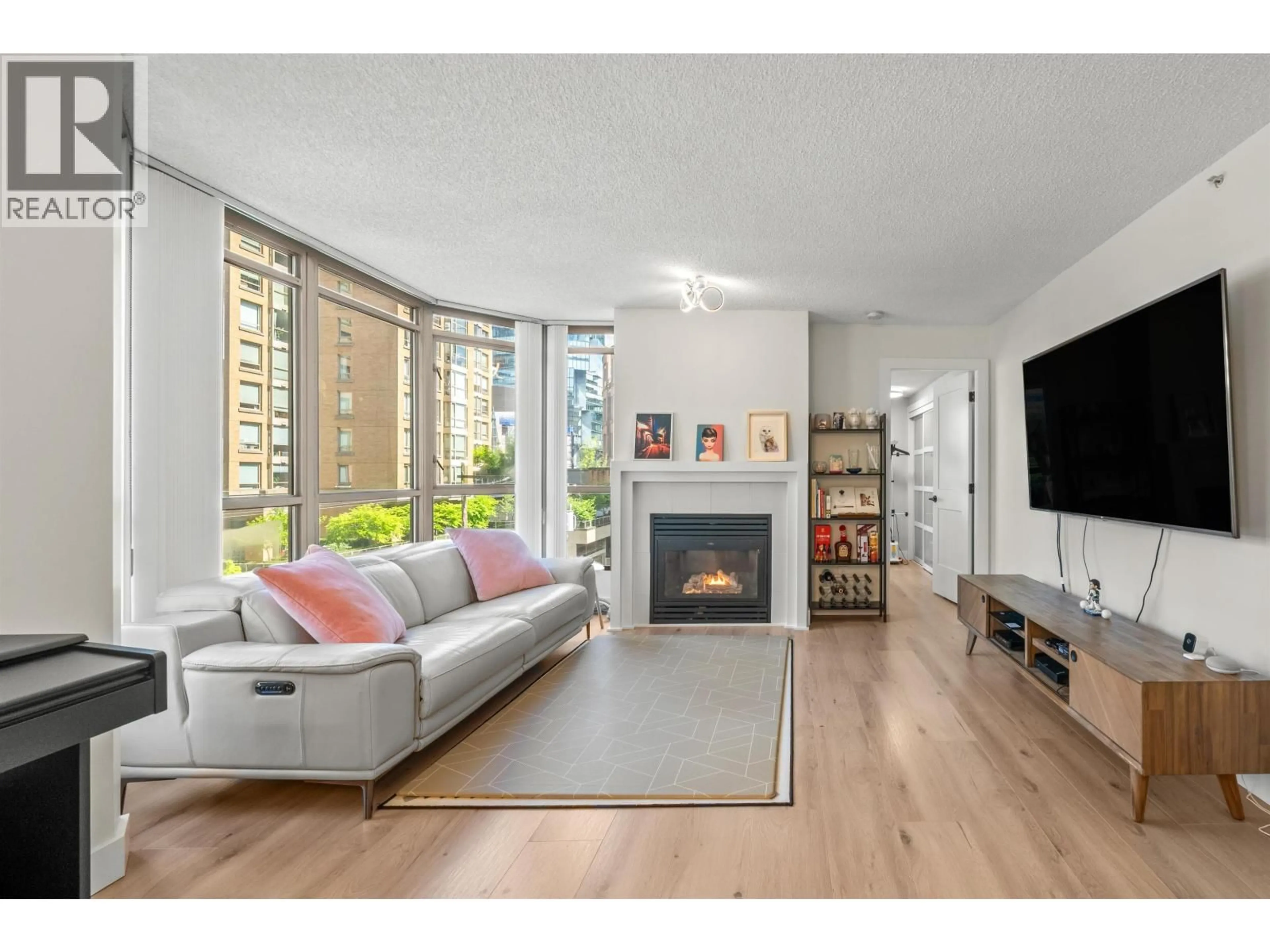 Living room with furniture, wood/laminate floor for 706 - 867 HAMILTON STREET, Vancouver British Columbia V6B2R7