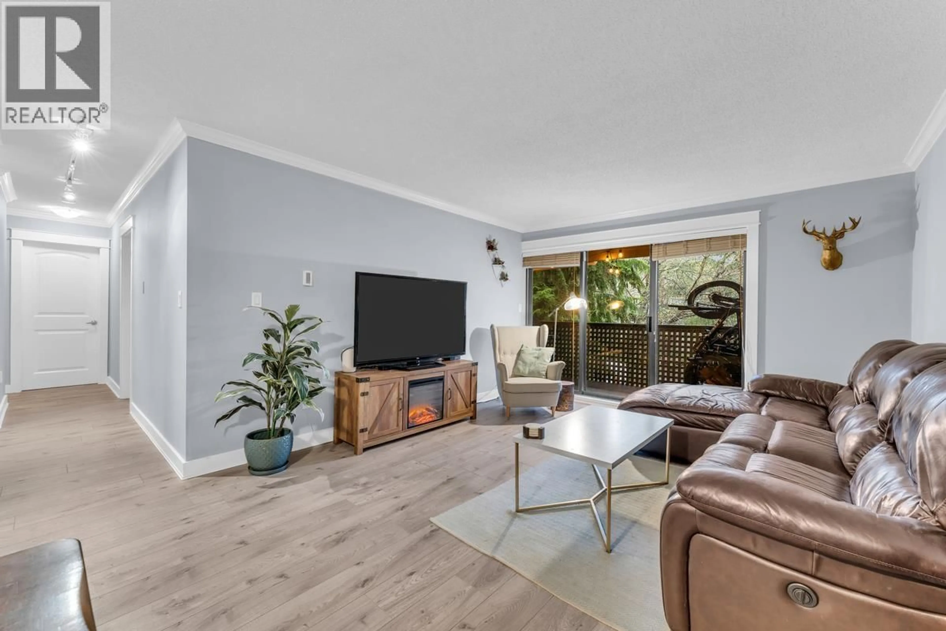 Living room with furniture, wood/laminate floor for 307 - 1210 PACIFIC STREET, Coquitlam British Columbia V3B6K3