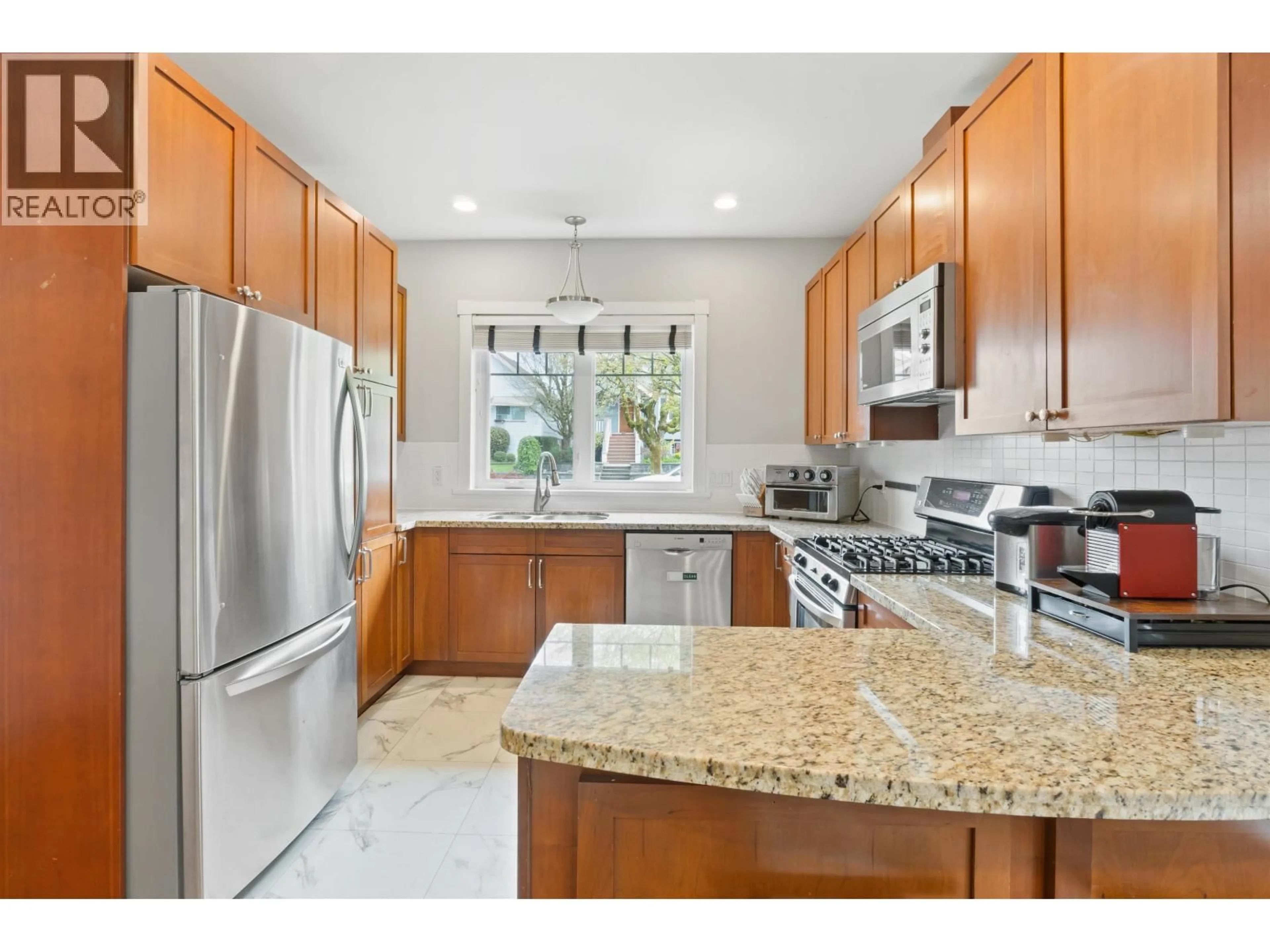 Open concept kitchen, ceramic/tile floor for 4103 INVERNESS STREET, Vancouver British Columbia V5V5C5