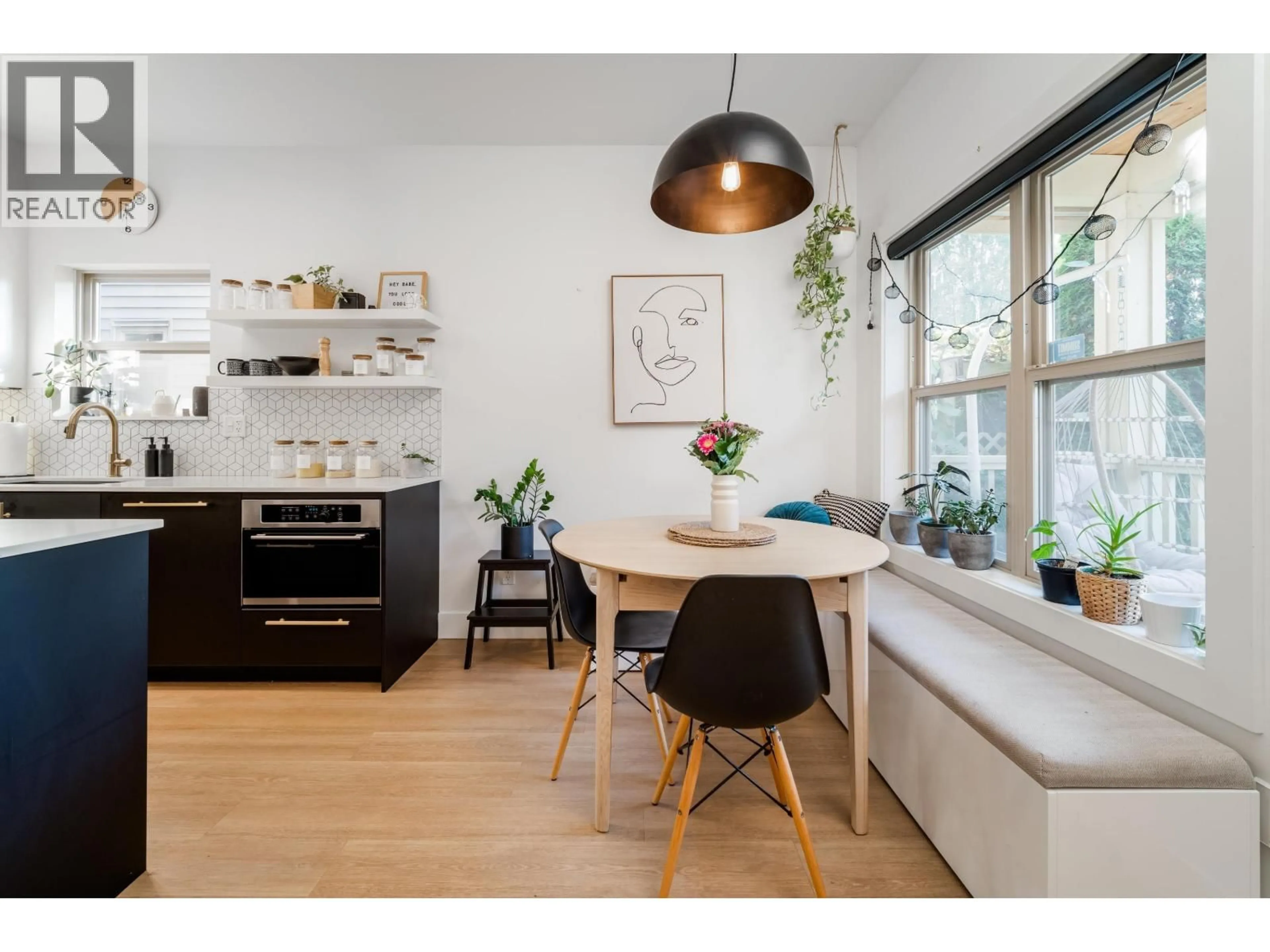 Open concept kitchen, wood/laminate floor for 5418 MAIN STREET, Vancouver British Columbia V5W2R9