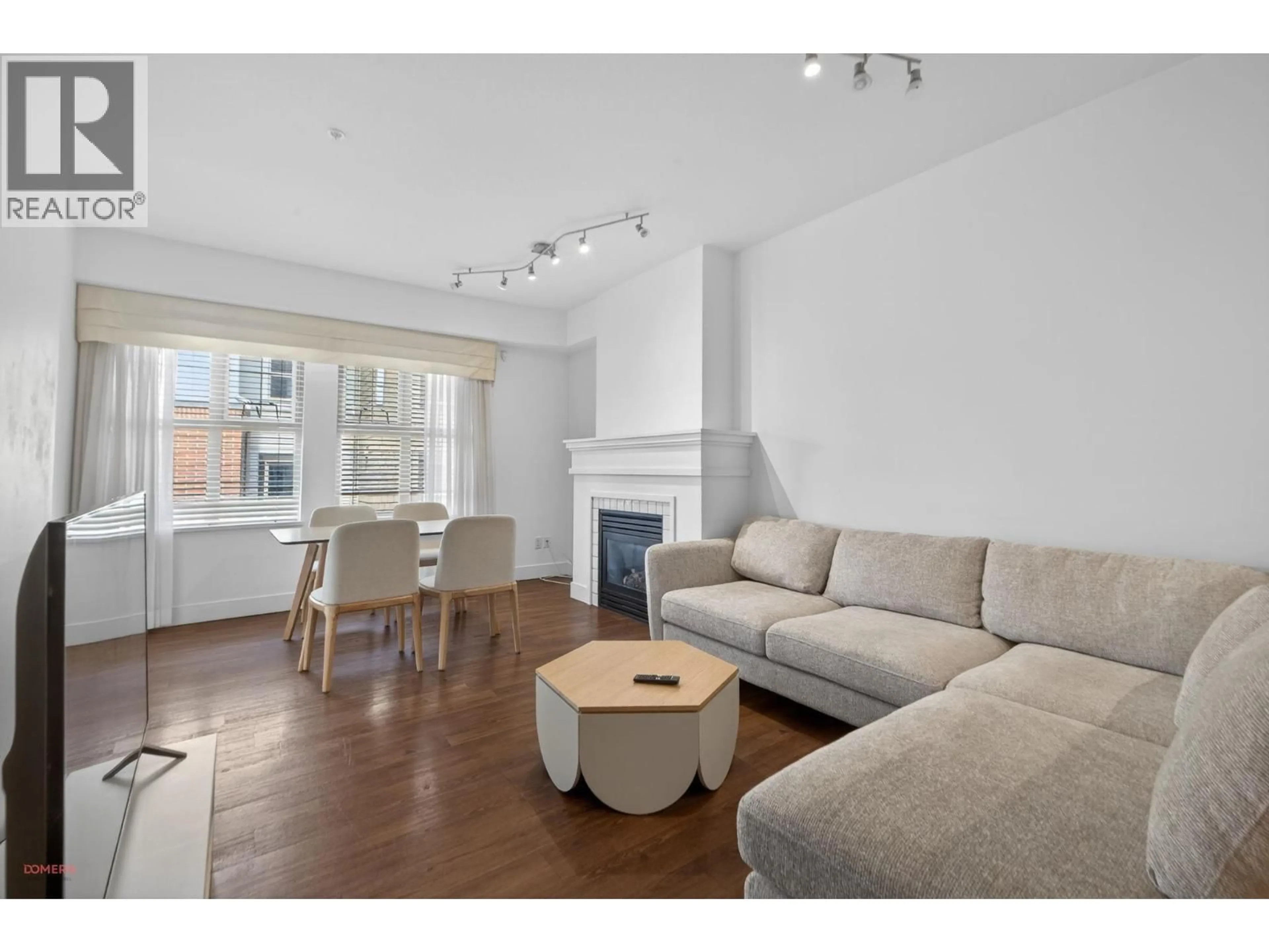 Living room with furniture, wood/laminate floor for 1304 - 4655 VALLEY DRIVE, Vancouver British Columbia V6J5L6