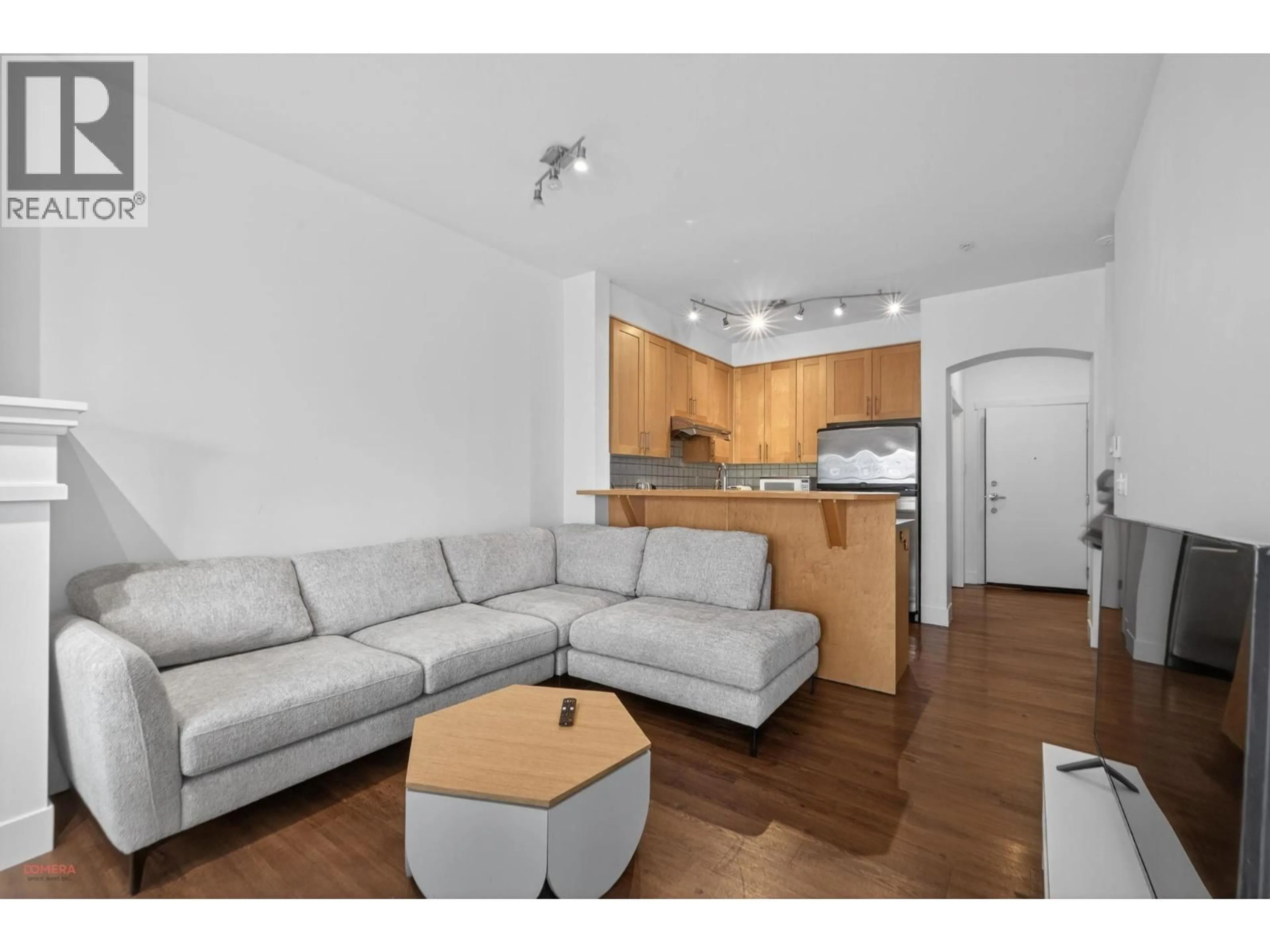 Living room with furniture, wood/laminate floor for 1304 - 4655 VALLEY DRIVE, Vancouver British Columbia V6J5L6