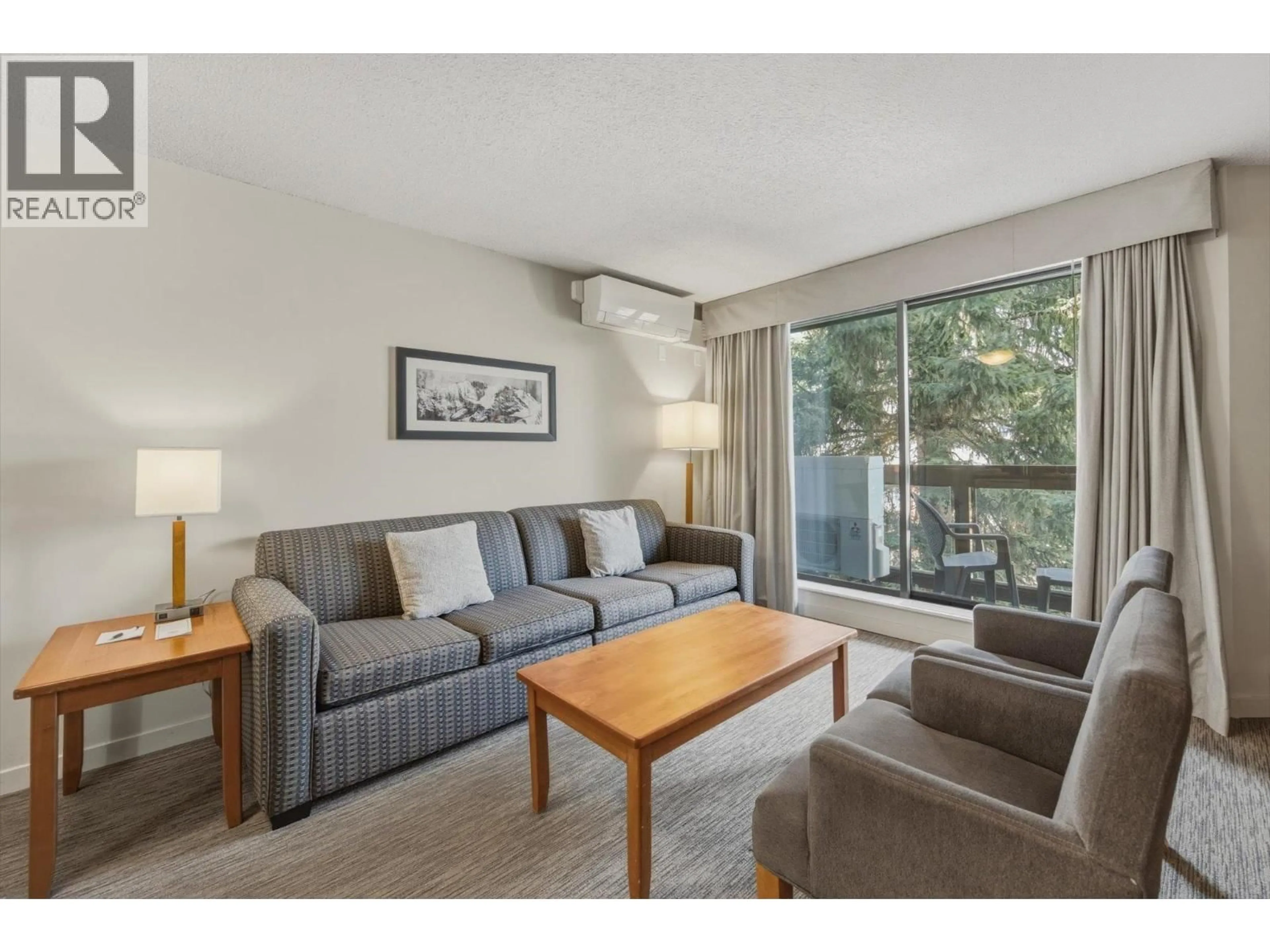 Living room with furniture, wood/laminate floor for 254 - 4429 SUNDIAL PLACE, Whistler British Columbia V8E1G8