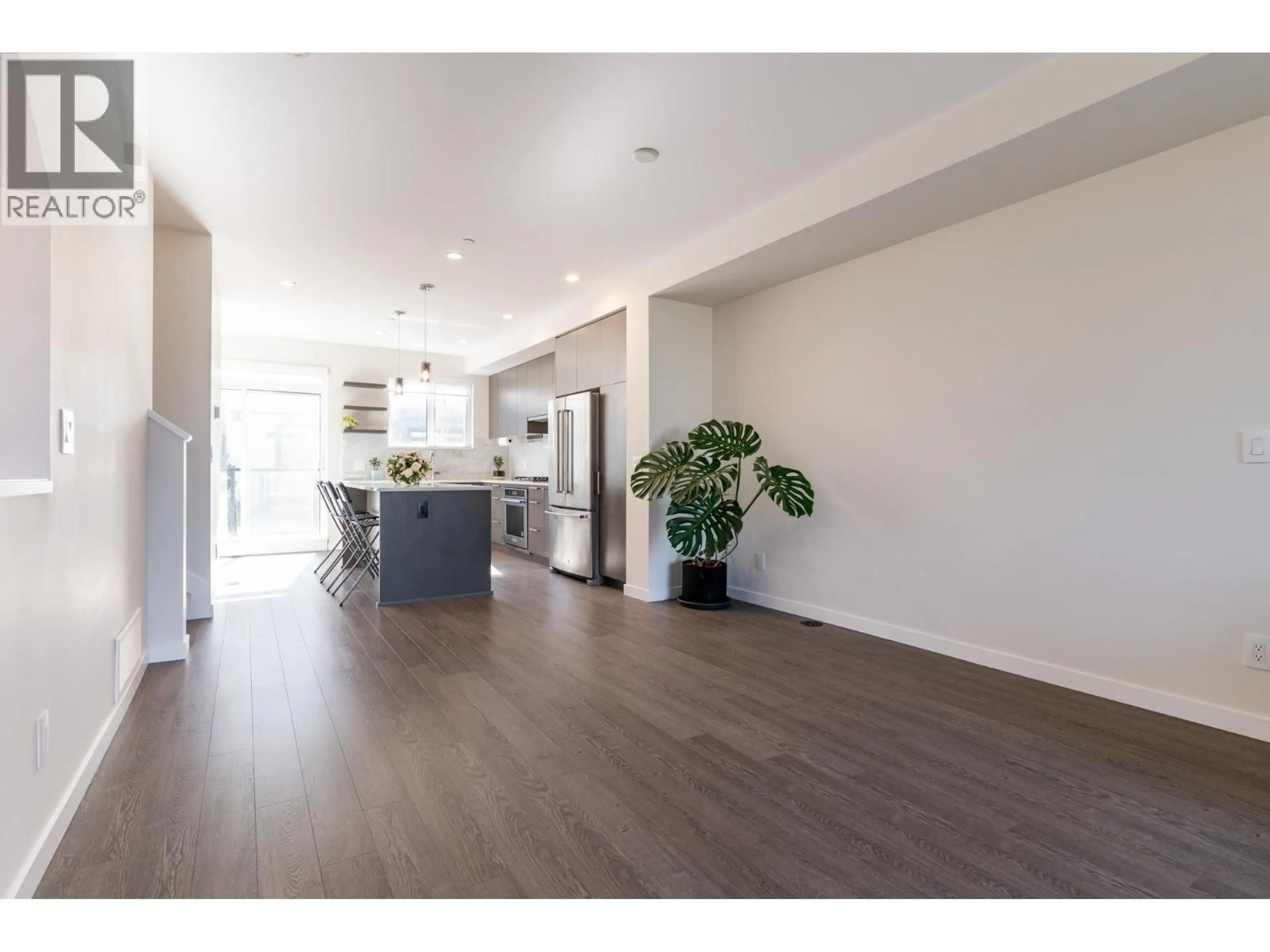 Open concept kitchen, wood/laminate floor for 175 - 4738 HEMLOCK WAY, Tsawwassen British Columbia V4M0E3