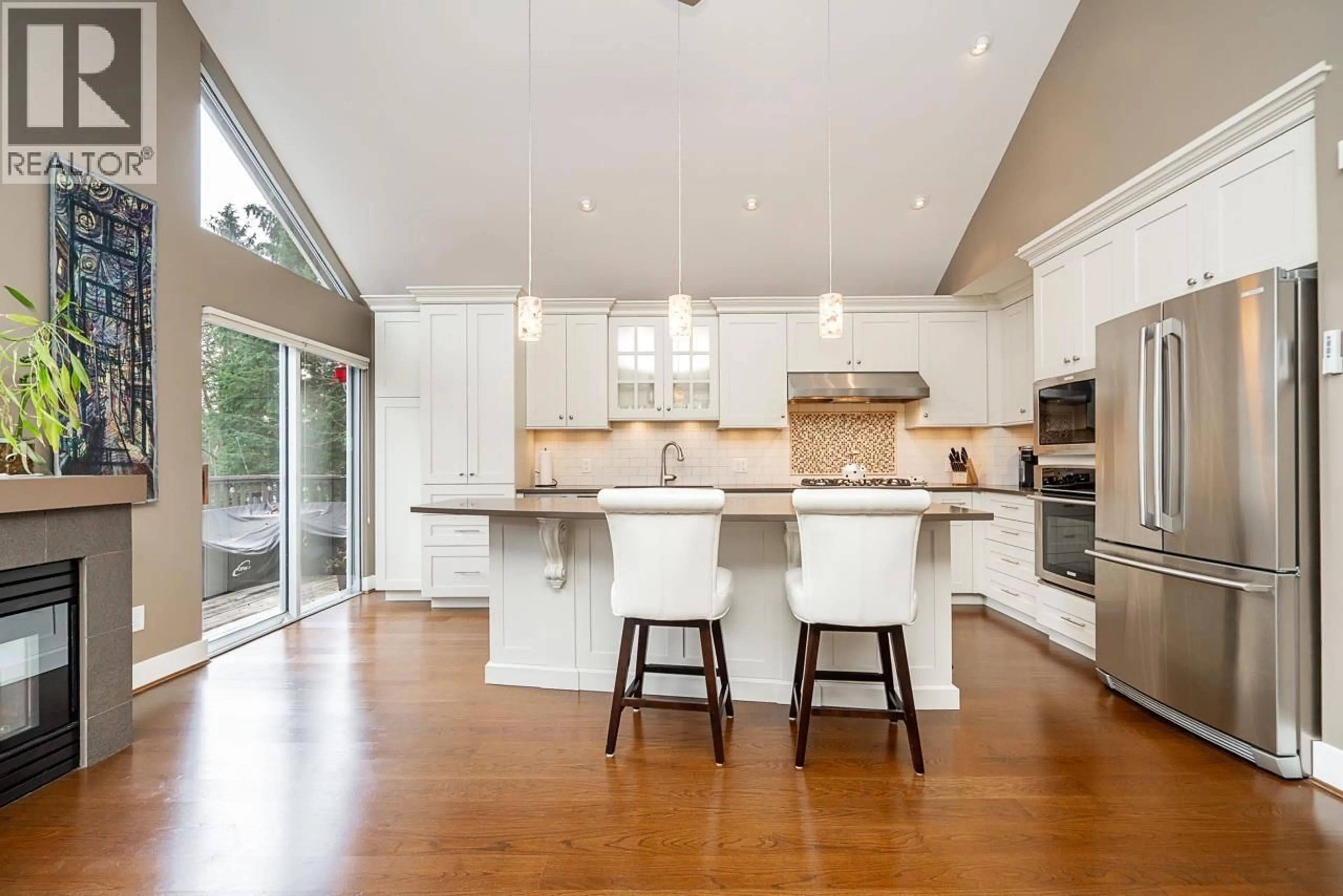 Open concept kitchen, wood/laminate floor for 22 - 4055 INDIAN RIVER DRIVE, North Vancouver British Columbia V7G2R7