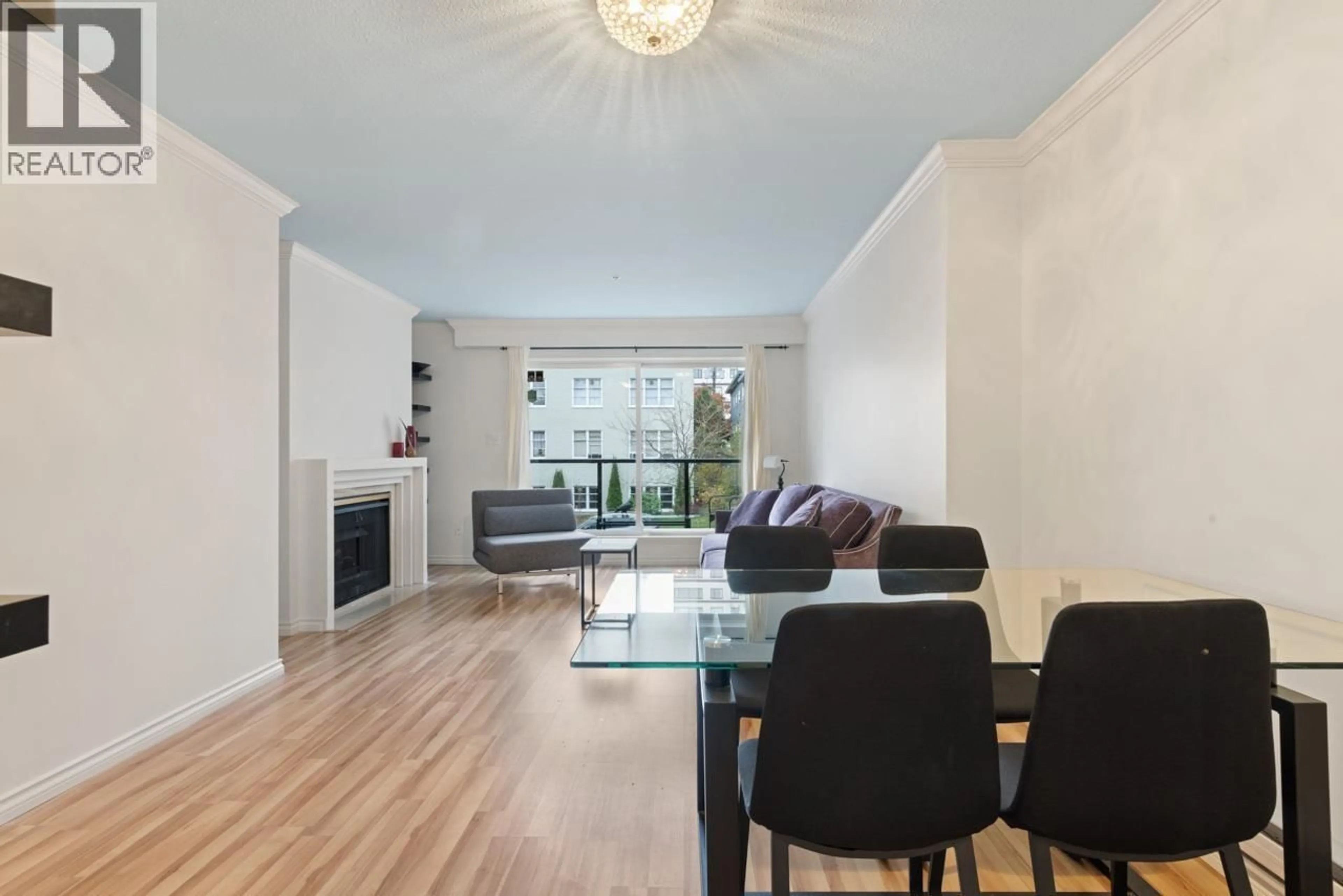 Living room with furniture, wood/laminate floor for 201 - 1554 BURNABY STREET, Vancouver British Columbia V6G1W9