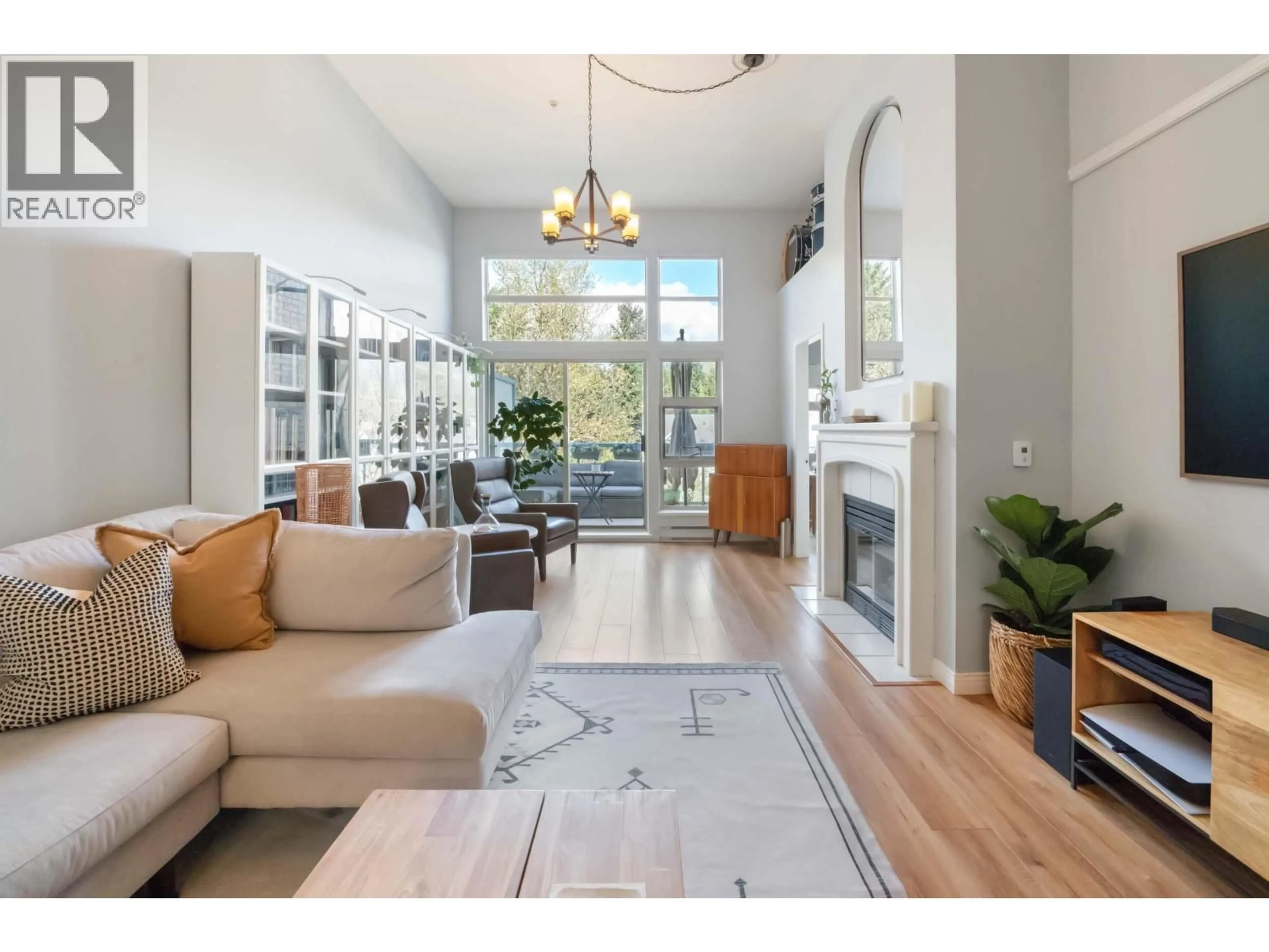 Living room with furniture, unknown for 606 - 301 MAUDE ROAD, Port Moody British Columbia V3H5B1