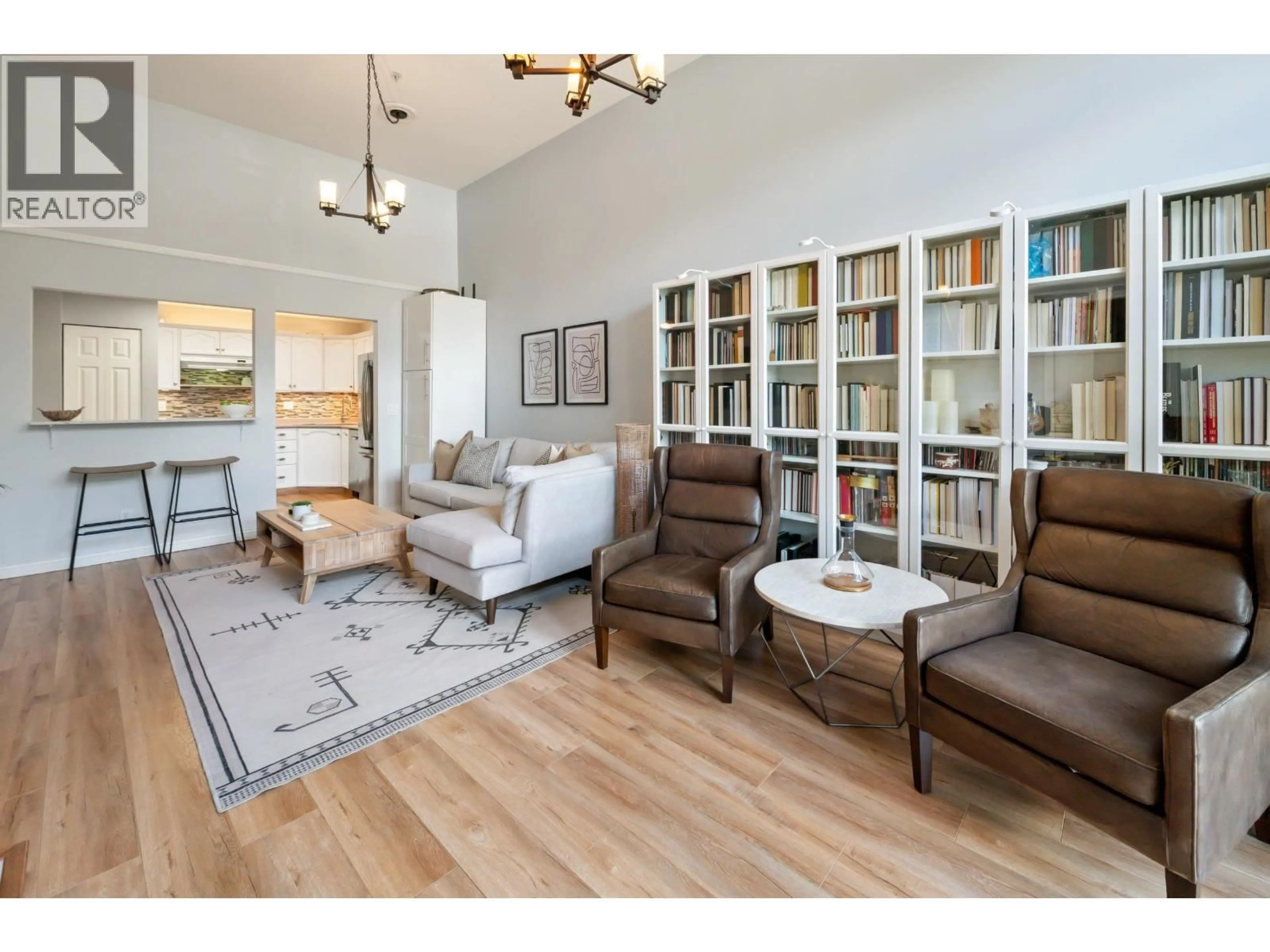 Living room with furniture, wood/laminate floor for 606 - 301 MAUDE ROAD, Port Moody British Columbia V3H5B1