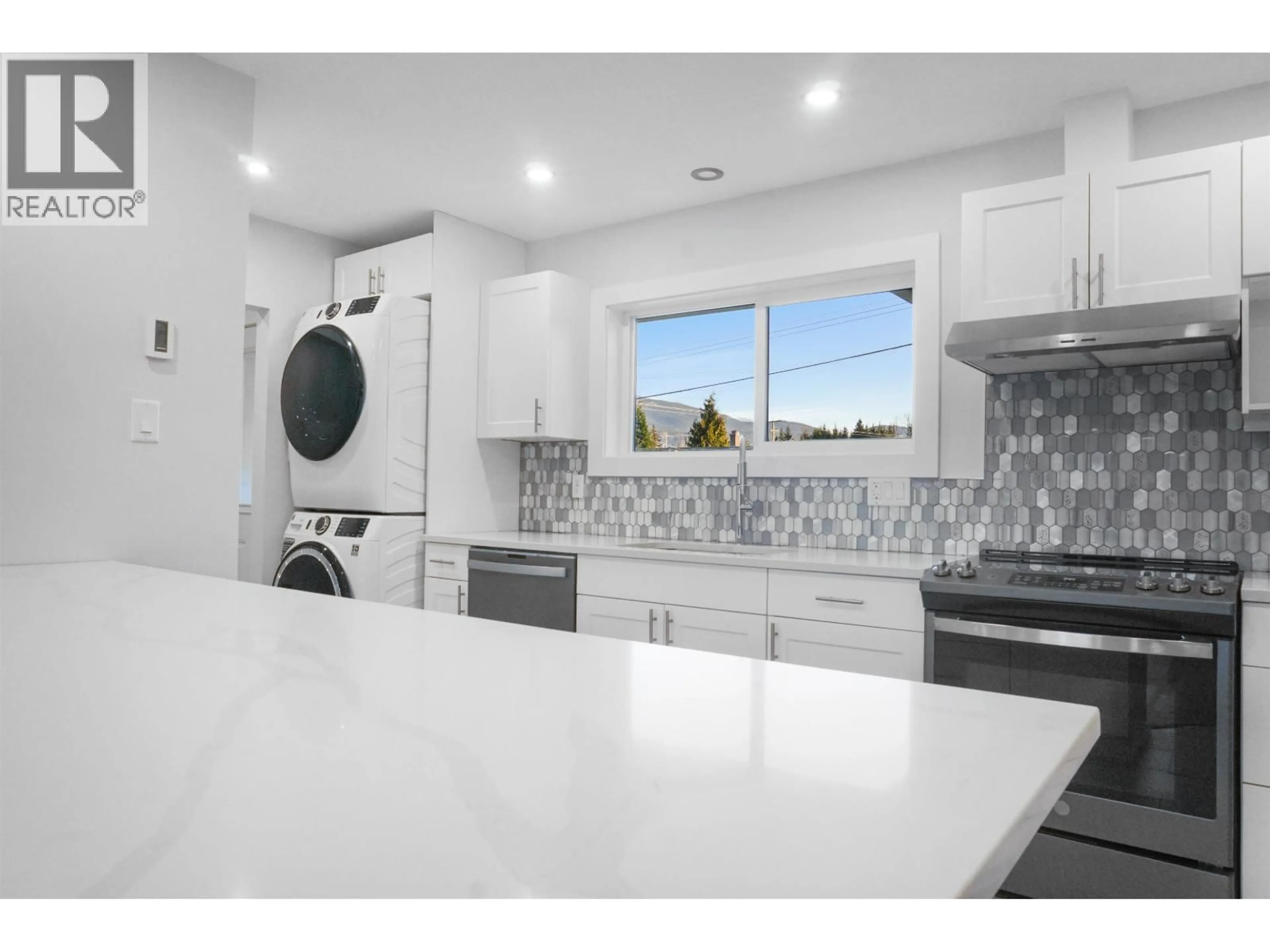 Kitchen with laundary machines, ceramic/tile floor for 13 YUKON STREET, Kitimat British Columbia V8C1Z3