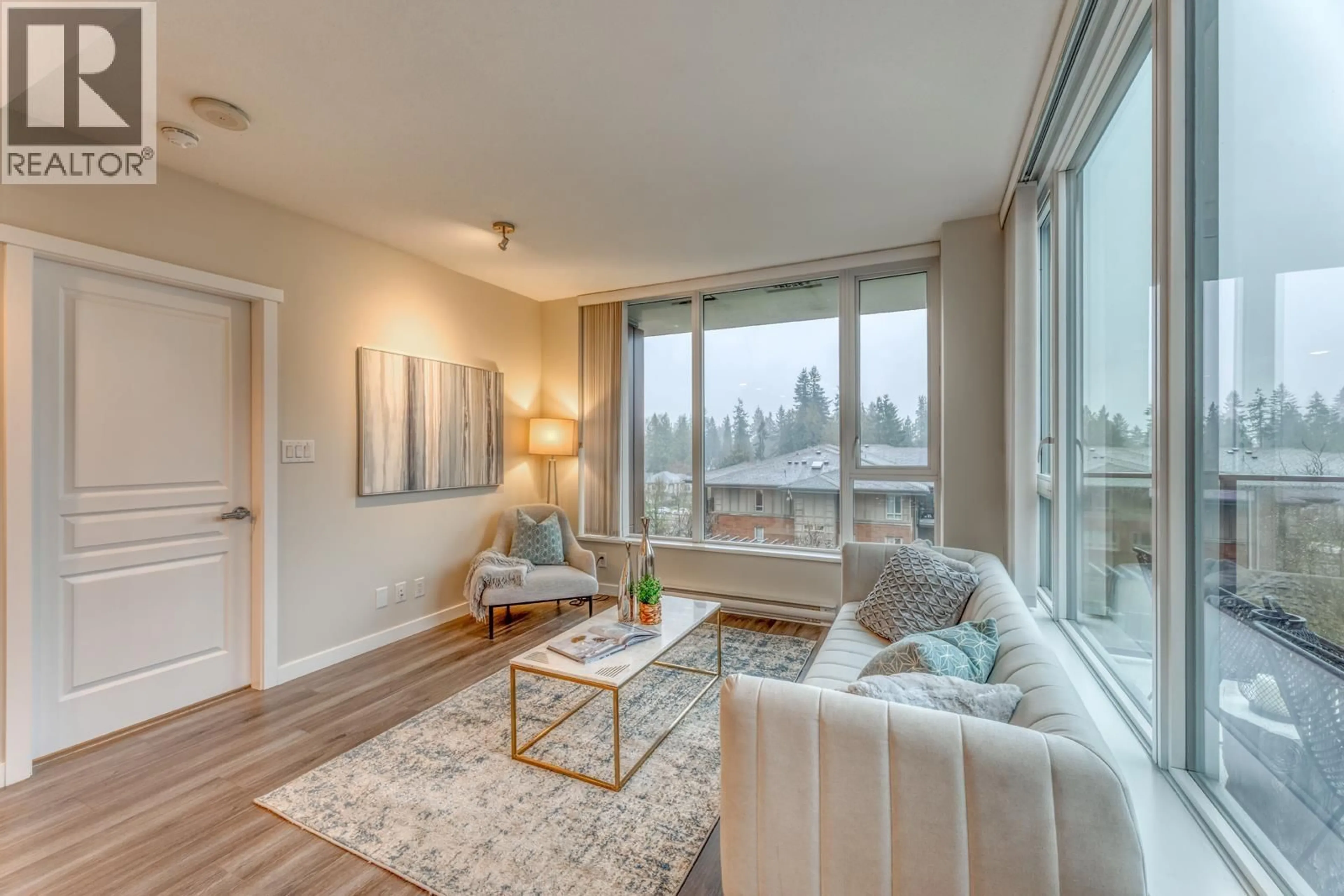 Living room with furniture, wood/laminate floor for 403 - 3100 WINDSOR GATE, Coquitlam British Columbia V3B0P3