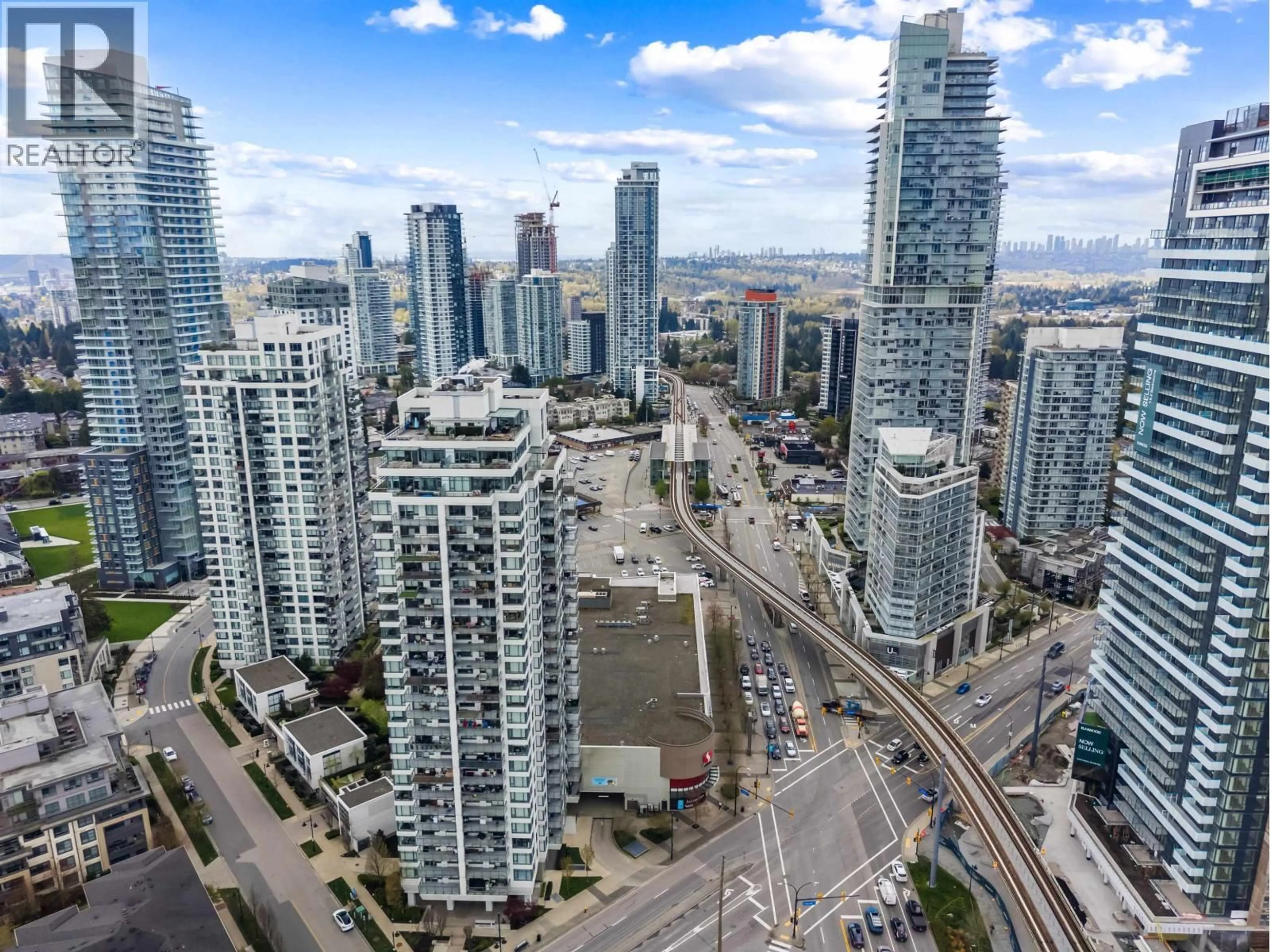 A pic from outside/outdoor area/front of a property/back of a property/a pic from drone, city buildings view from balcony for 1206 - 602 COMO LAKE AVENUE, Coquitlam British Columbia V3J0G2