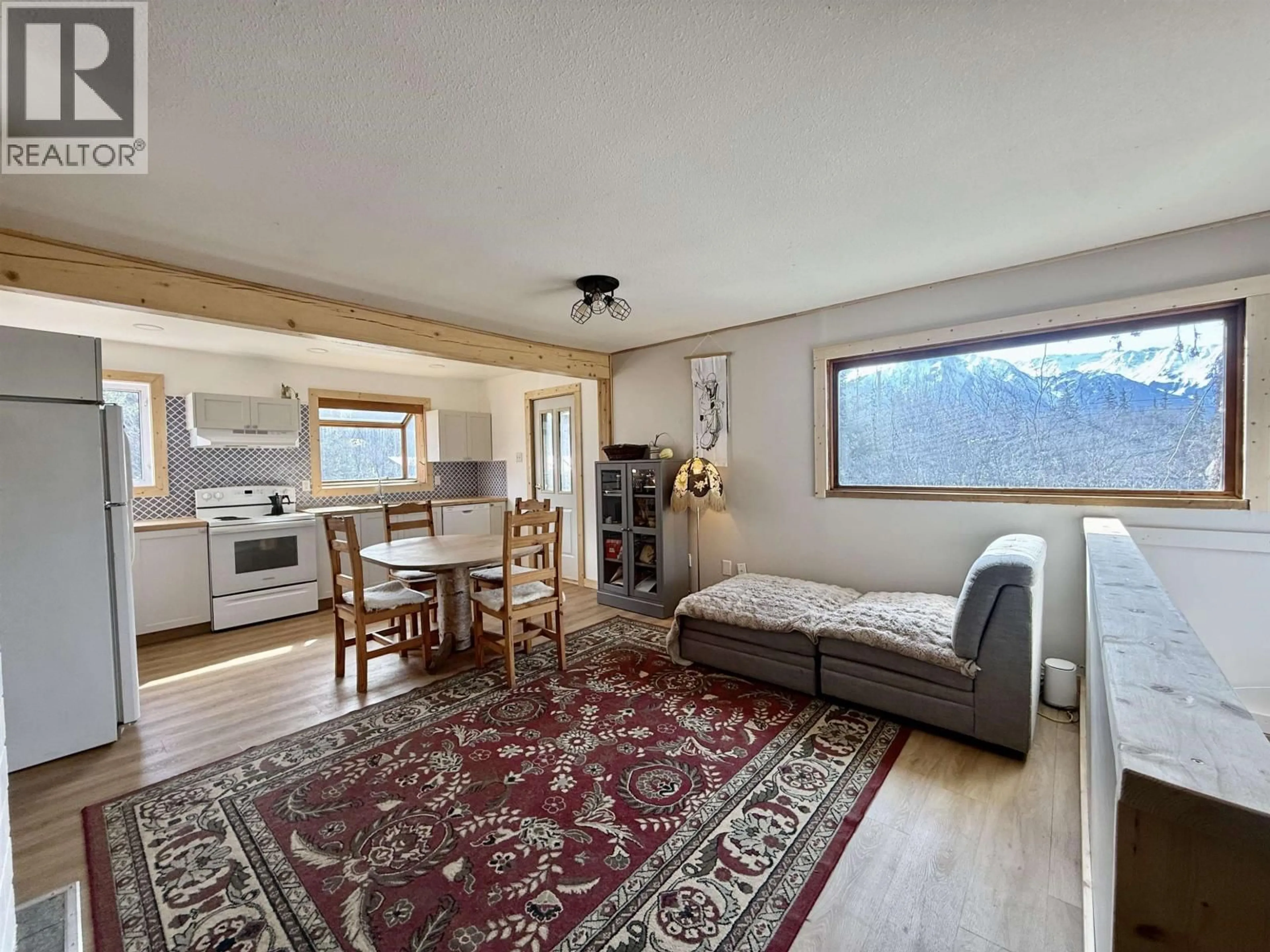 Living room with furniture, wood/laminate floor for 5950 SILVER STANDARD ROAD, Hazelton British Columbia V0J1Y1