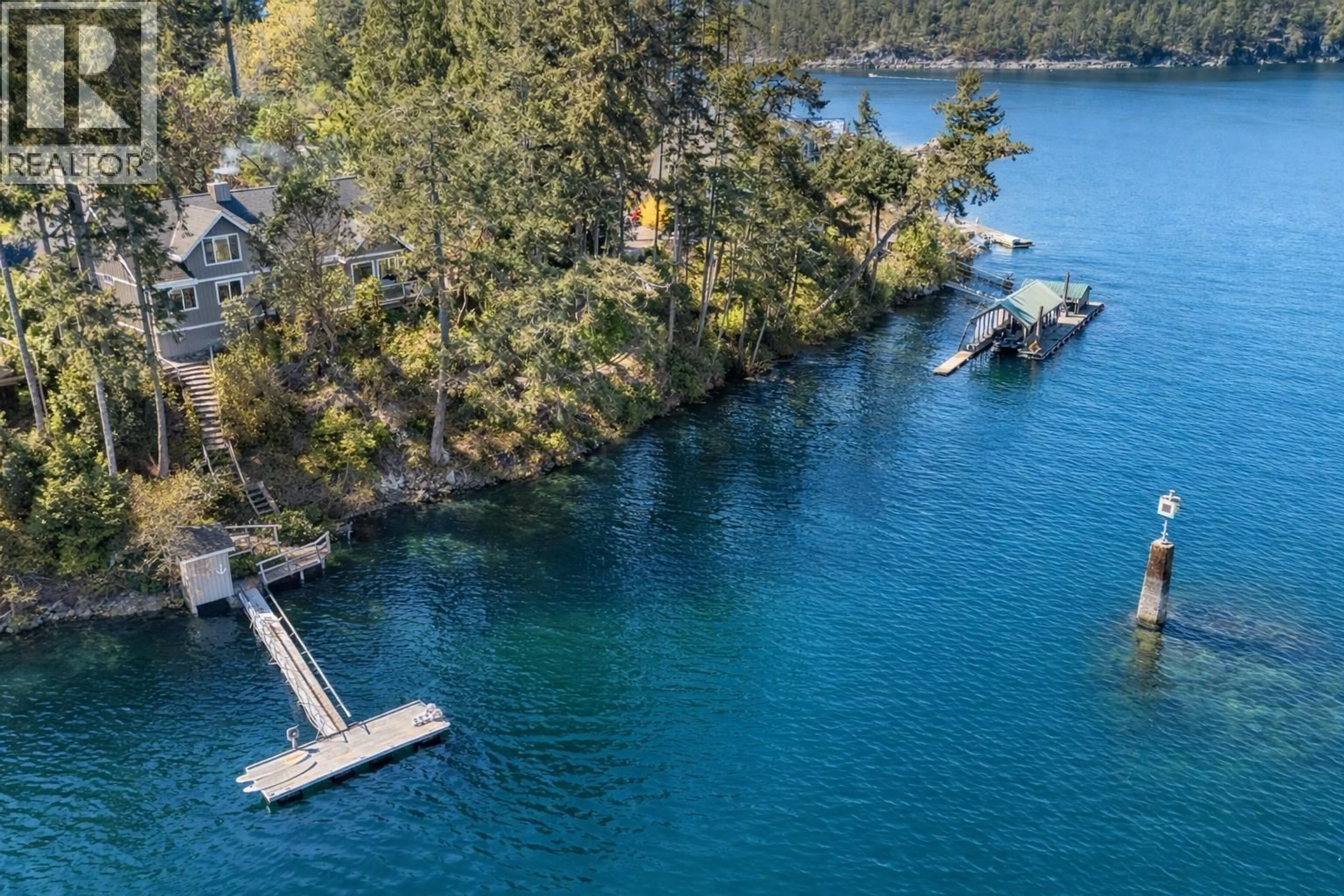 A pic from outside/outdoor area/front of a property/back of a property/a pic from drone, water/lake/river/ocean view for 10040 WESCAN ROAD, Halfmoon Bay British Columbia V0N1Y2