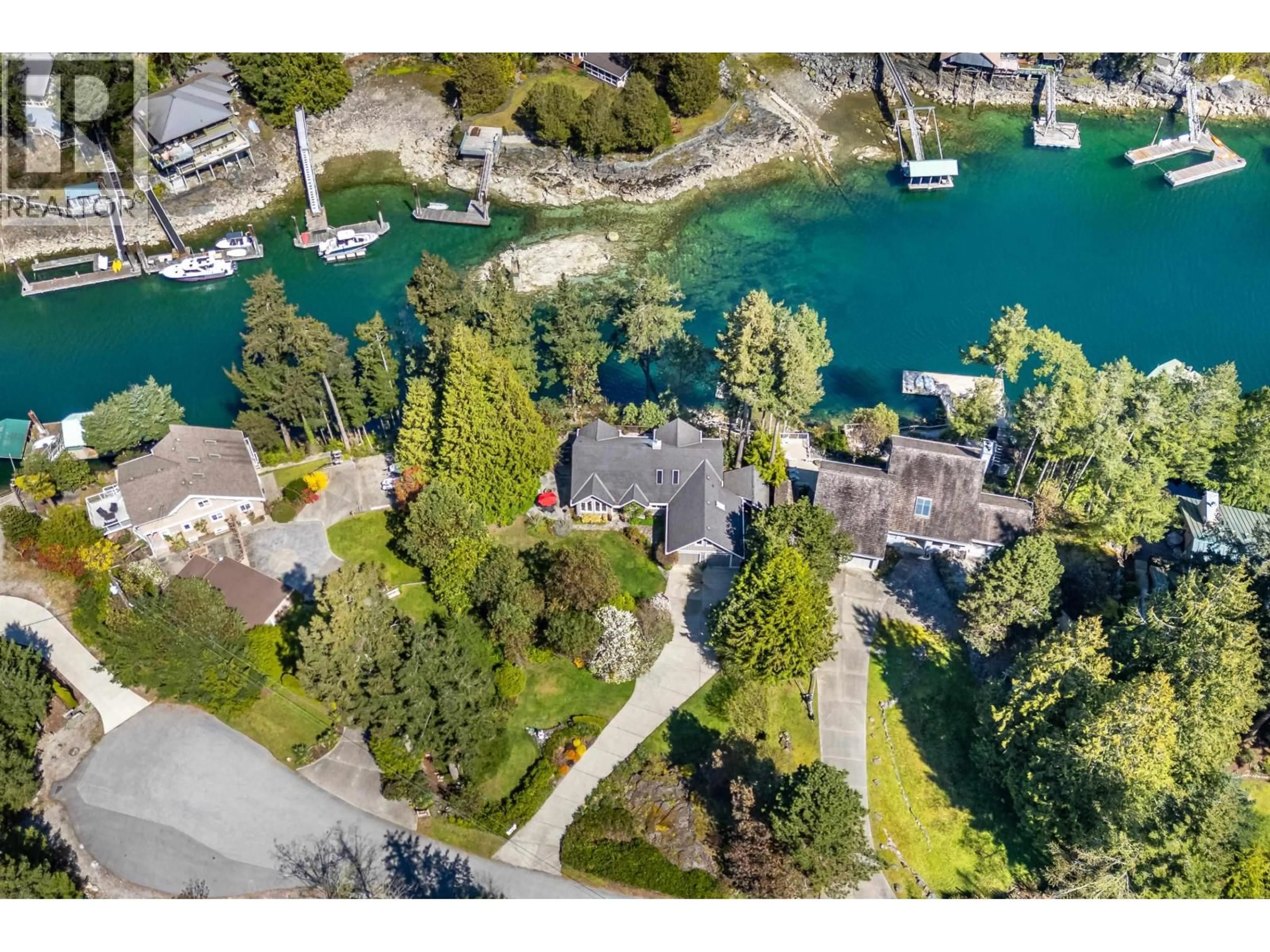 A pic from outside/outdoor area/front of a property/back of a property/a pic from drone, water/lake/river/ocean view for 10040 WESCAN ROAD, Halfmoon Bay British Columbia V0N1Y2