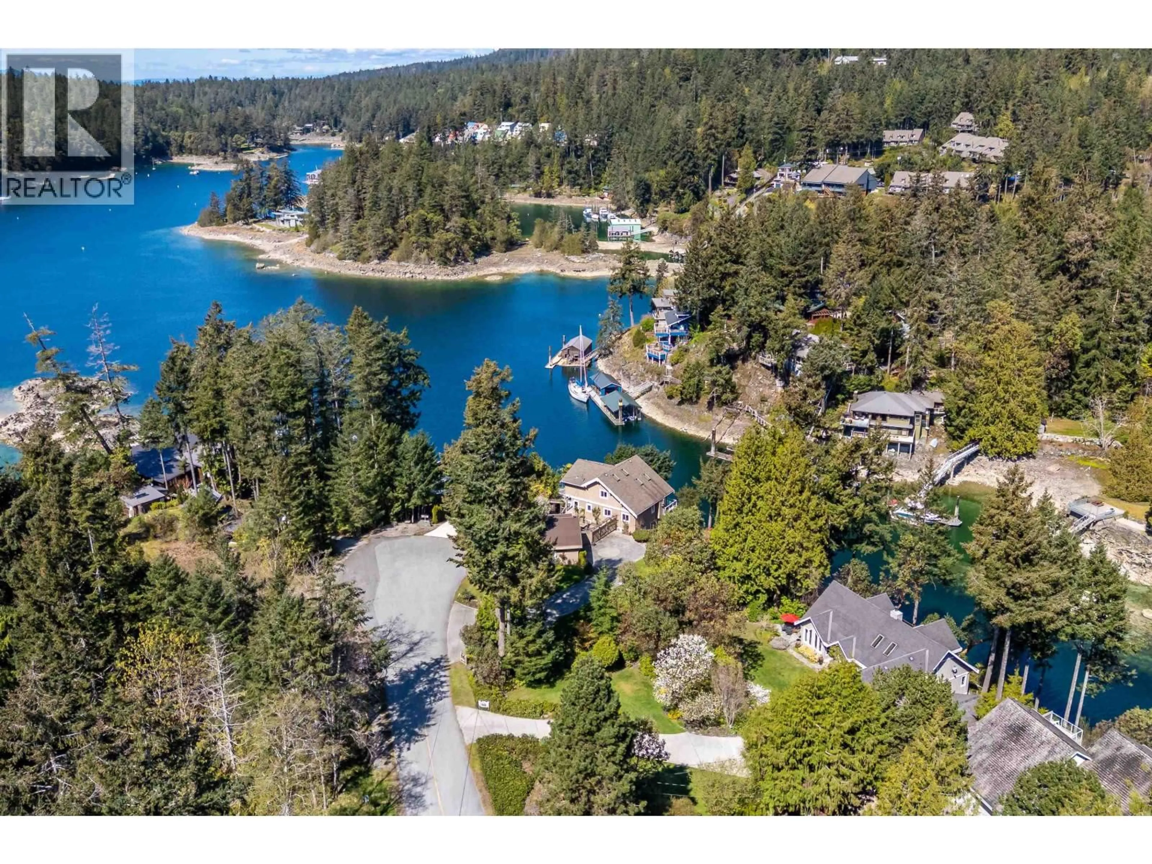 A pic from outside/outdoor area/front of a property/back of a property/a pic from drone, water/lake/river/ocean view for 10040 WESCAN ROAD, Halfmoon Bay British Columbia V0N1Y2