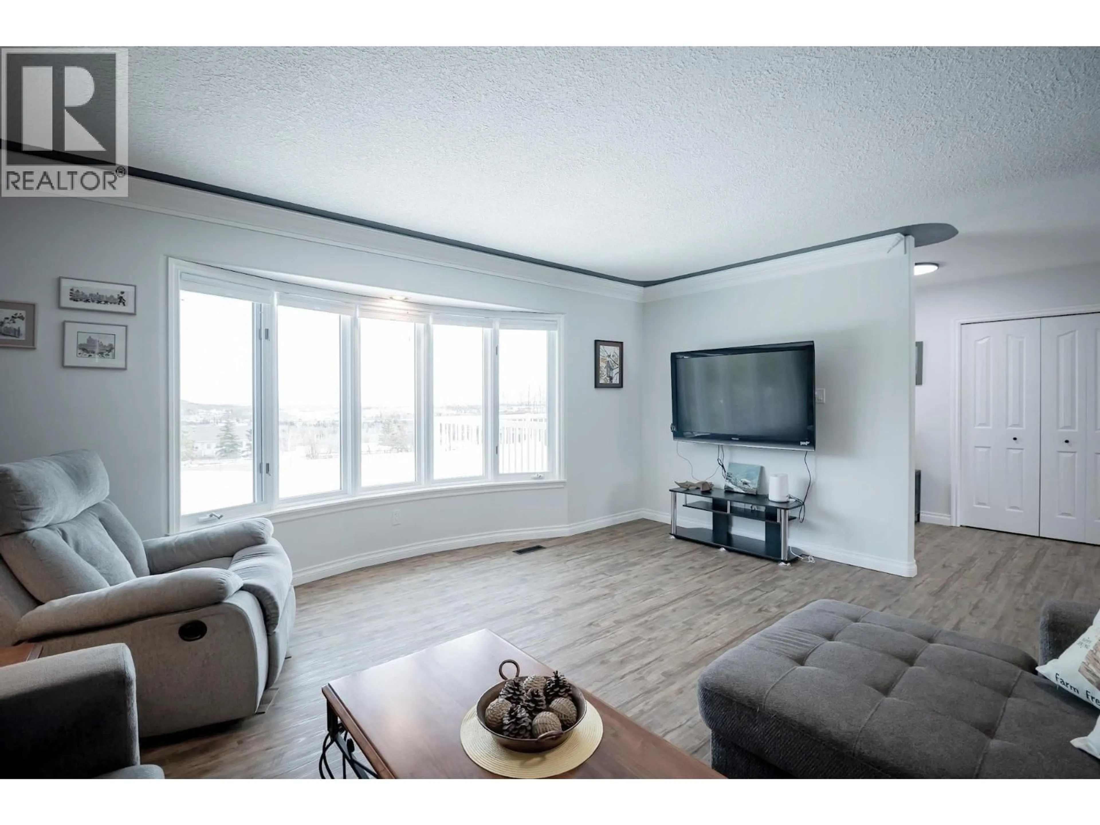 Living room with furniture, wood/laminate floor for 12903 AGNES LANE, Charlie Lake British Columbia V0C1H0