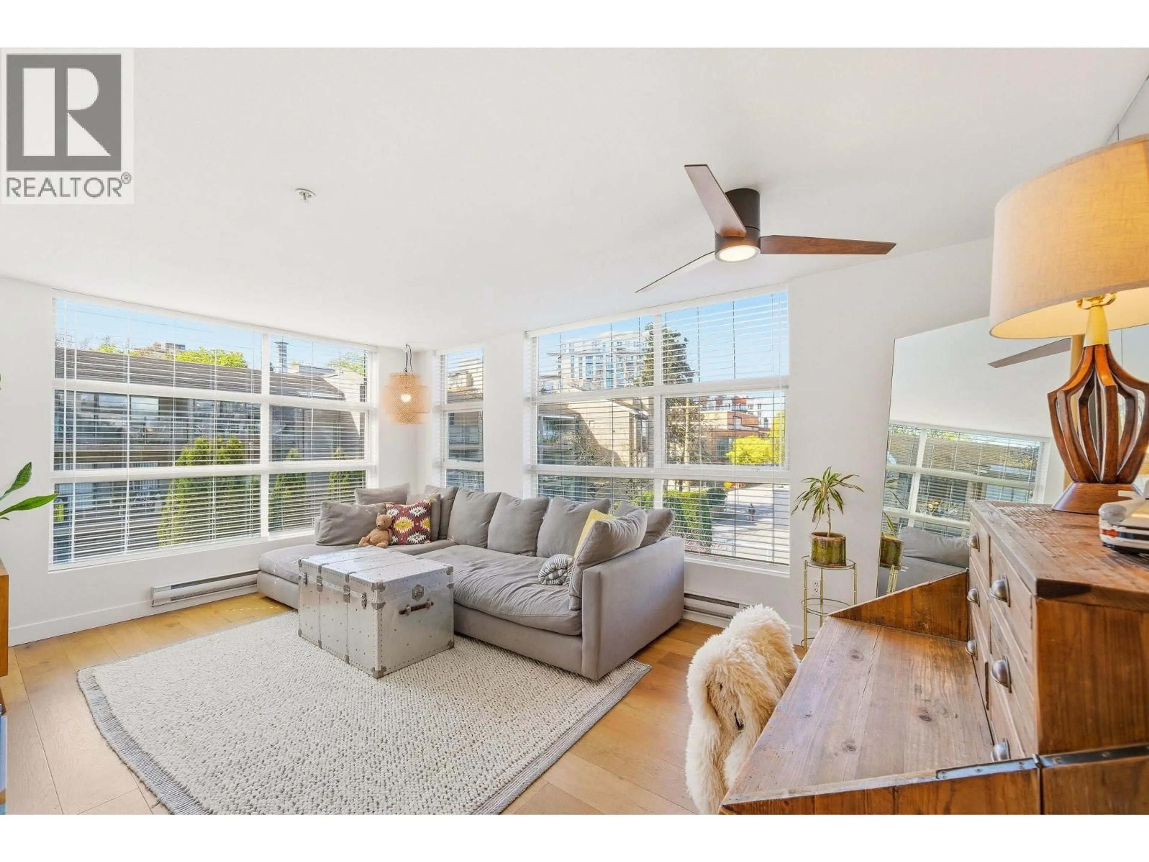 Living room with furniture, wood/laminate floor for 309 - 418 BROADWAY, Vancouver British Columbia V5T1X2