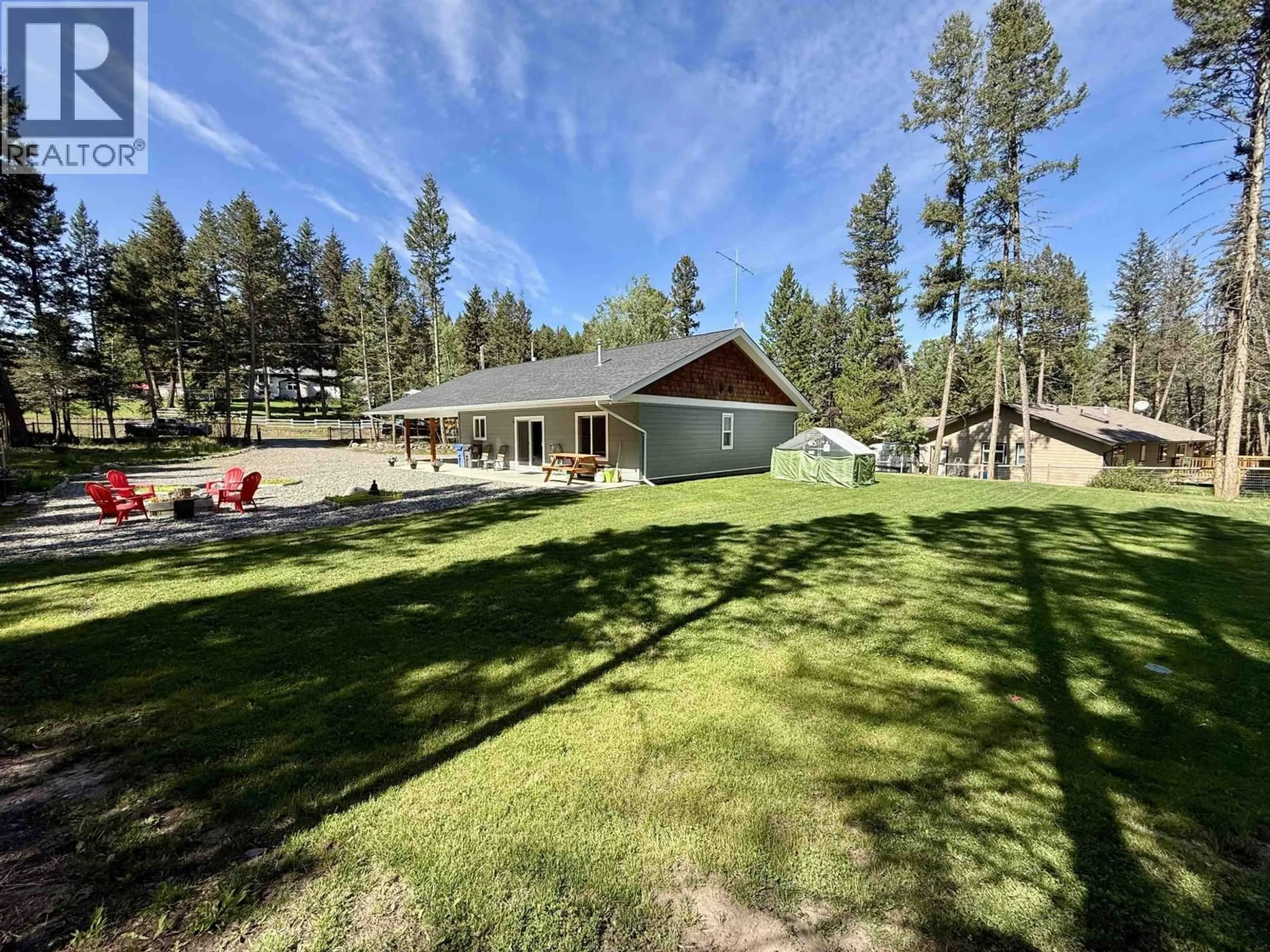 A pic from outside/outdoor area/front of a property/back of a property/a pic from drone, unknown for 4985 KYLLO ROAD, 108 Mile Ranch British Columbia V0K2Z0