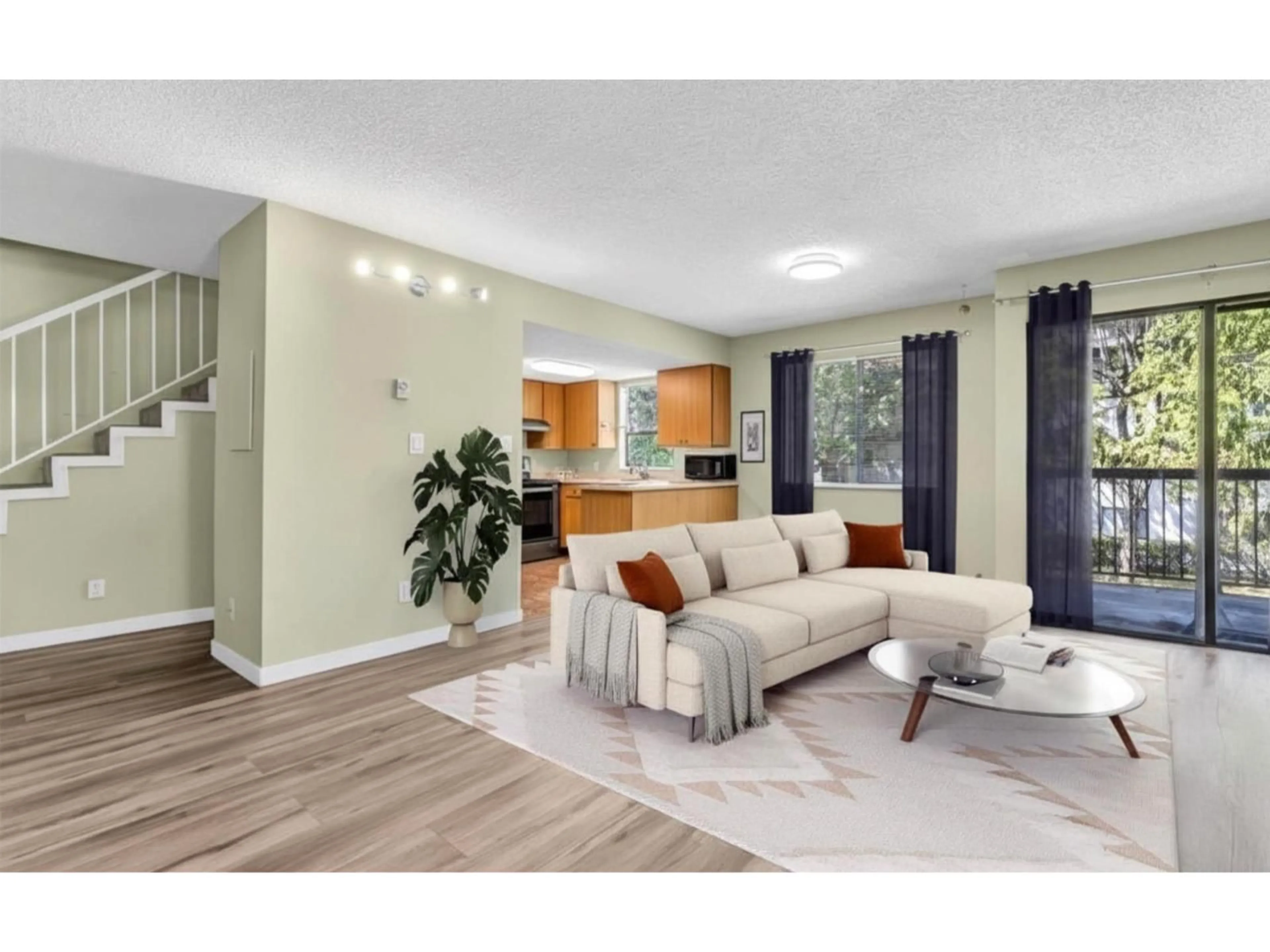 Living room with furniture, wood/laminate floor for 201 - 13316 71B AVENUE, Surrey British Columbia V3W7Z4