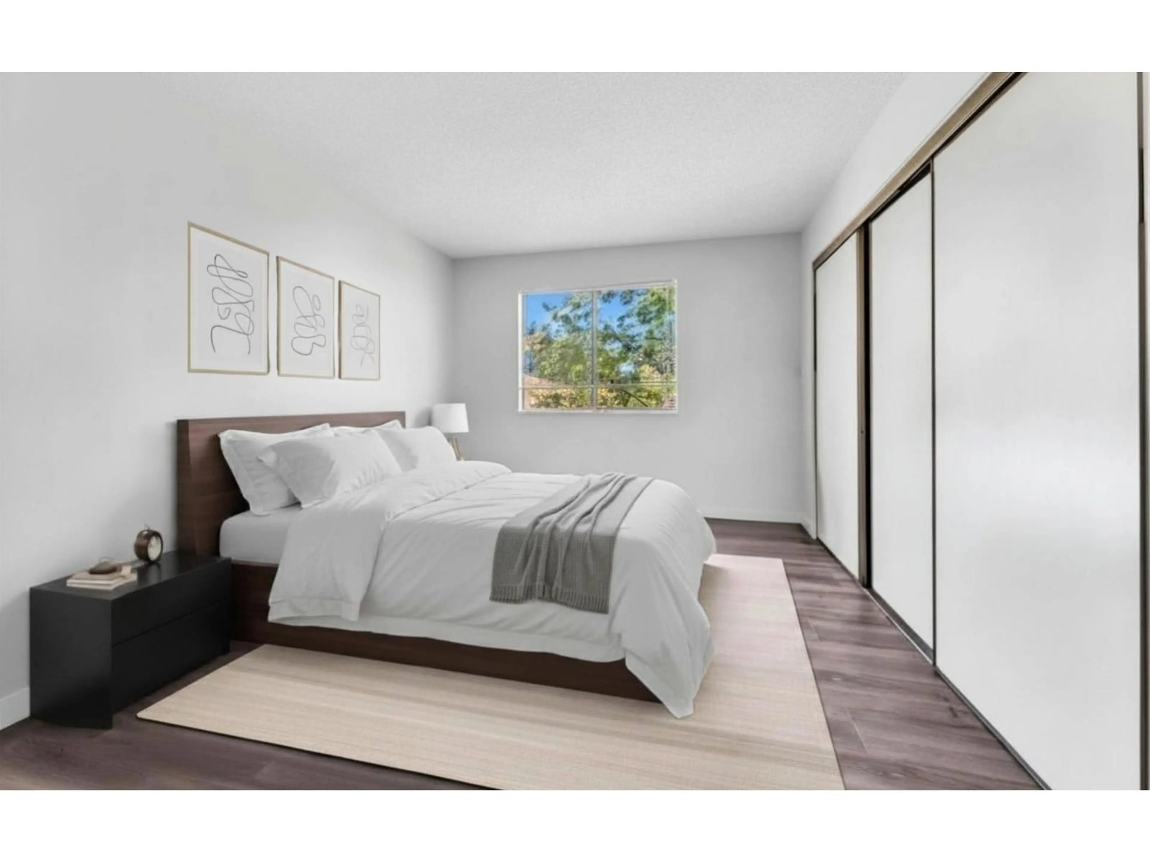 Bedroom with bed, wood/laminate floor for 201 - 13316 71B AVENUE, Surrey British Columbia V3W7Z4