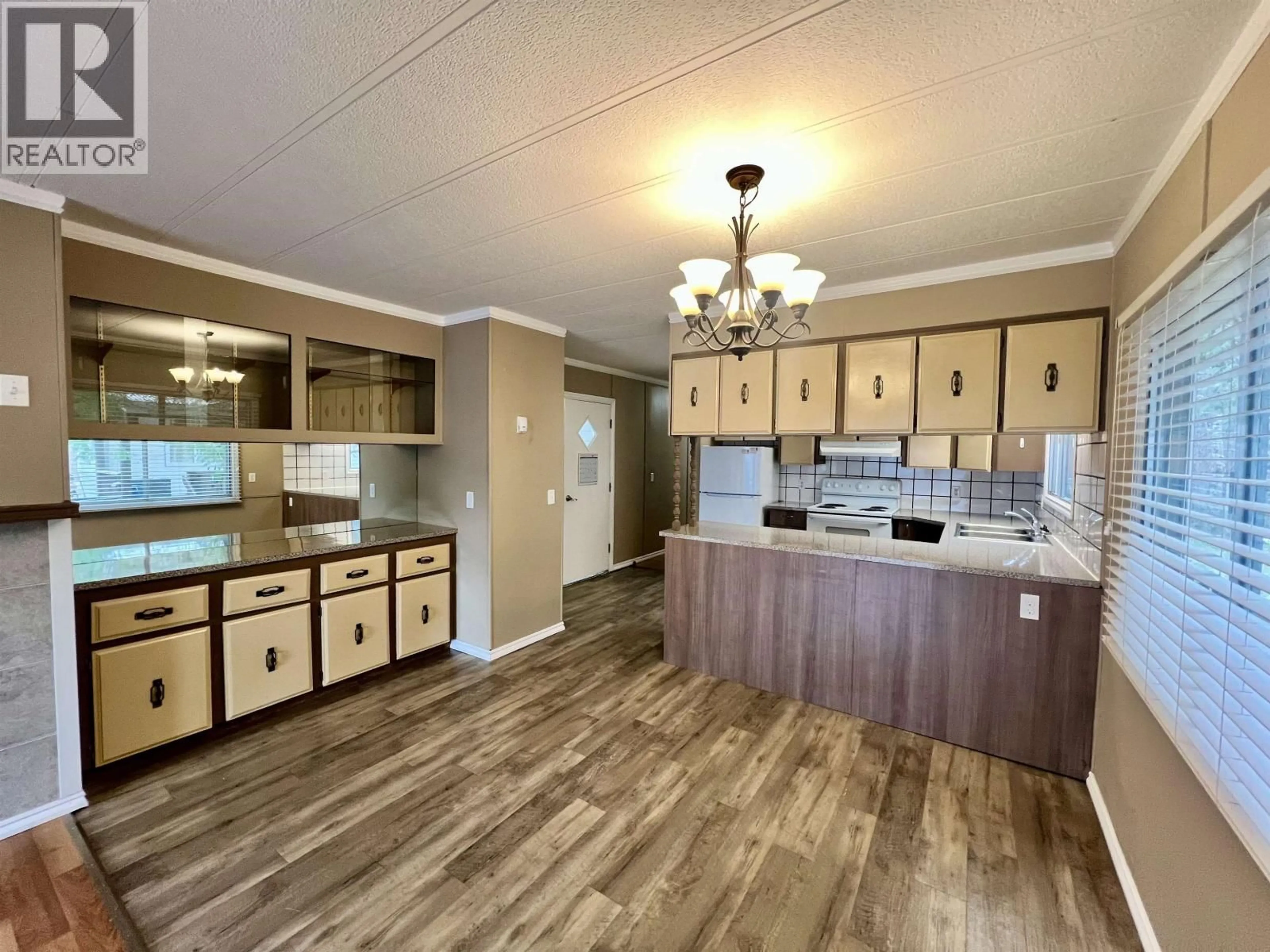 Open concept kitchen, wood/laminate floor for 33 - 4619 LOWRIE AVENUE, Terrace British Columbia V8G3X5