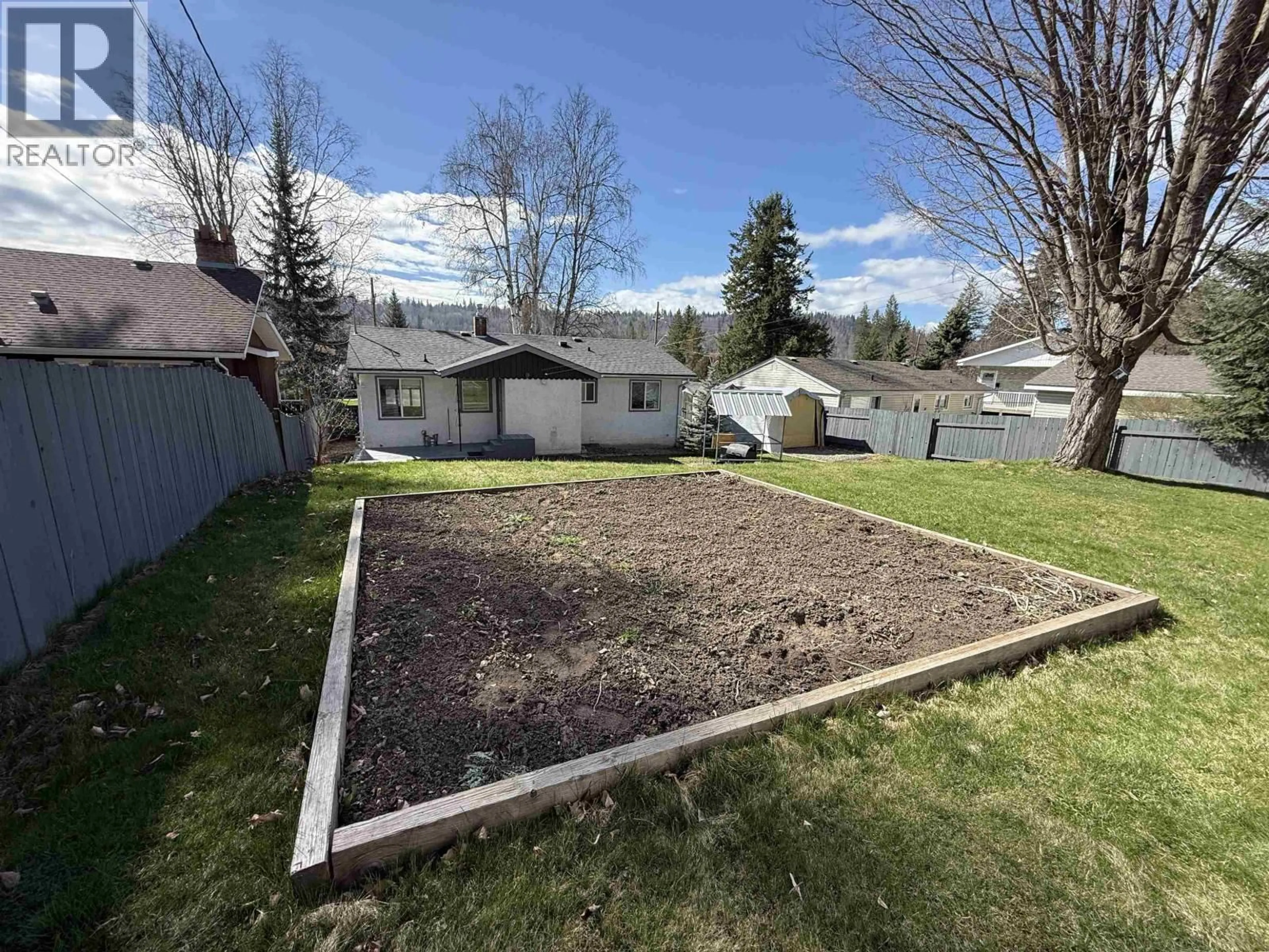 A pic from outside/outdoor area/front of a property/back of a property/a pic from drone, mountain view for 1001 JOHNSTON AVENUE, Quesnel British Columbia V2J3B9