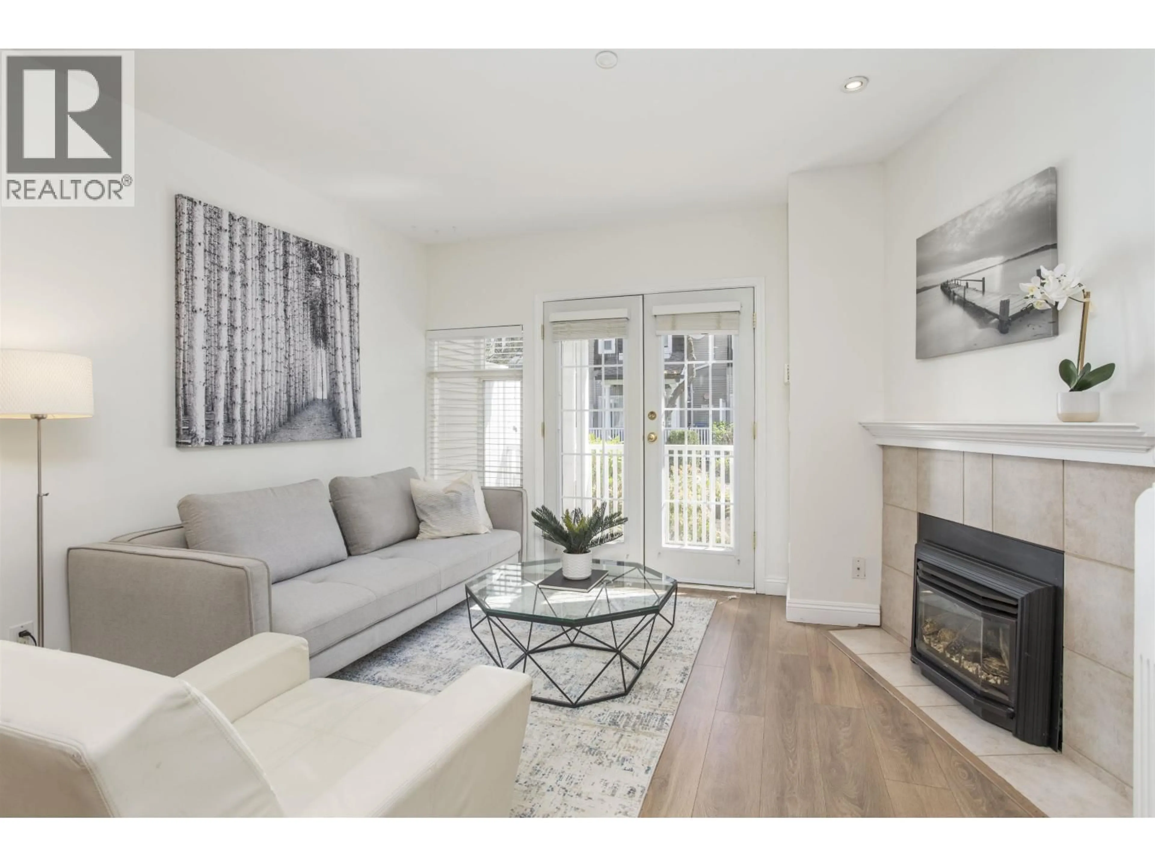 Living room with furniture, wood/laminate floor for 2836 KENT AVENUE SOUTH, Vancouver British Columbia V5S4T4
