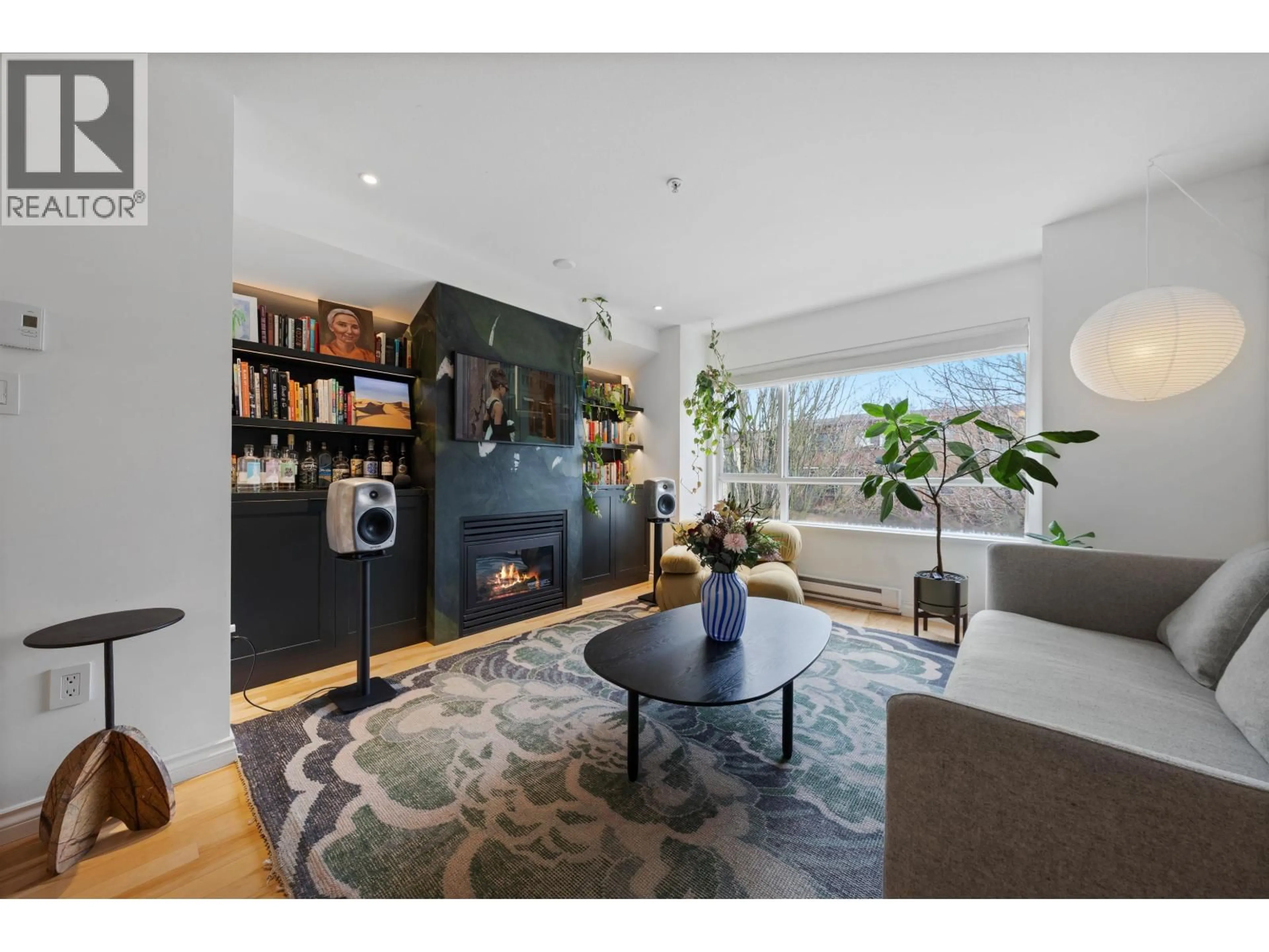 Living room with furniture, wood/laminate floor for 303 - 2688 WATSON STREET, Vancouver British Columbia V5T4T6