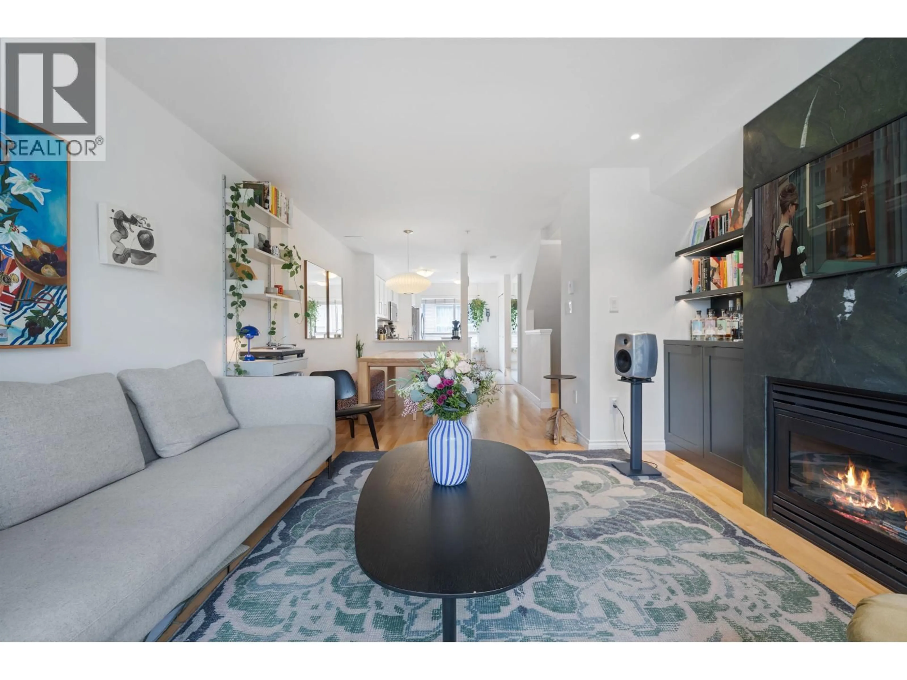 Living room with furniture, wood/laminate floor for 303 - 2688 WATSON STREET, Vancouver British Columbia V5T4T6