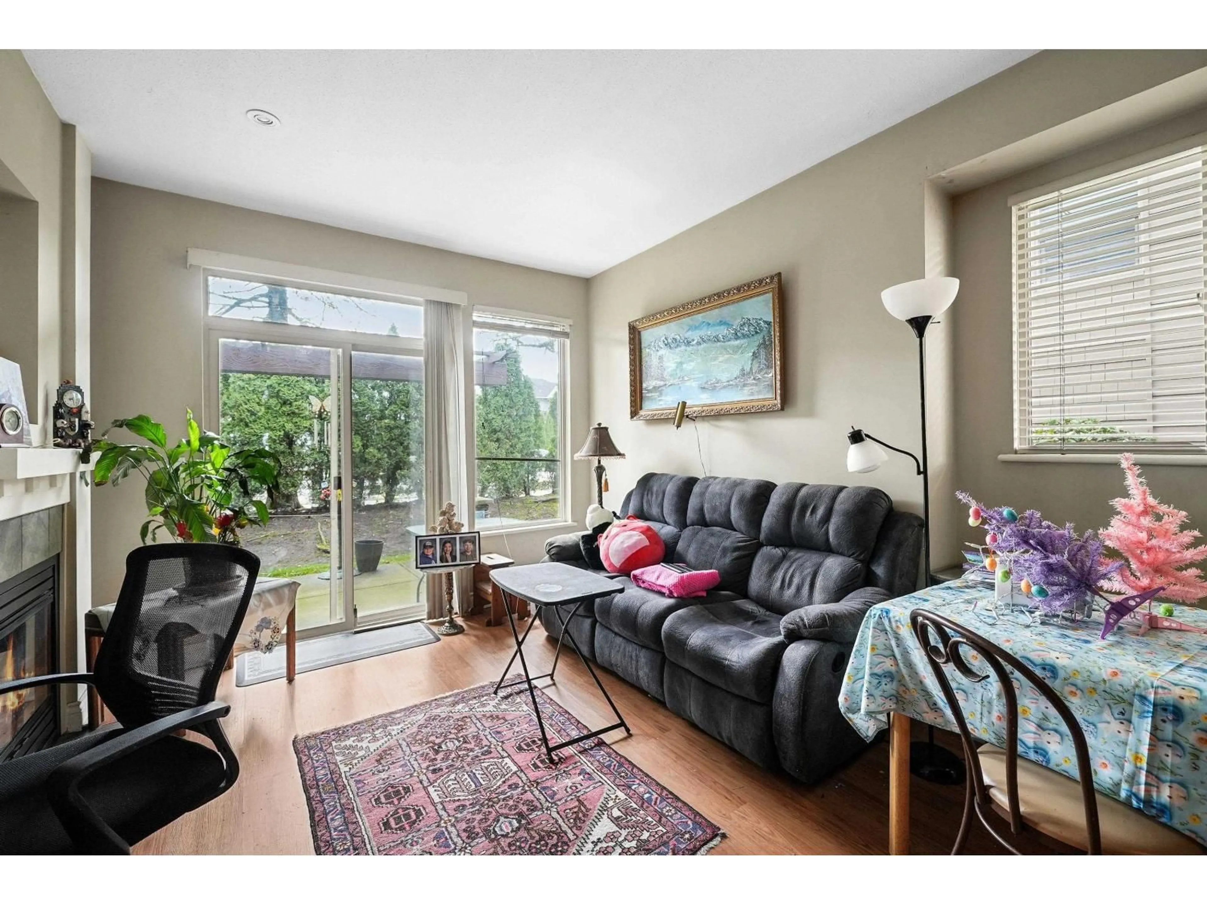 Living room with furniture, wood/laminate floor for 103 - 16655 64 AVENUE, Surrey British Columbia V3S3V1