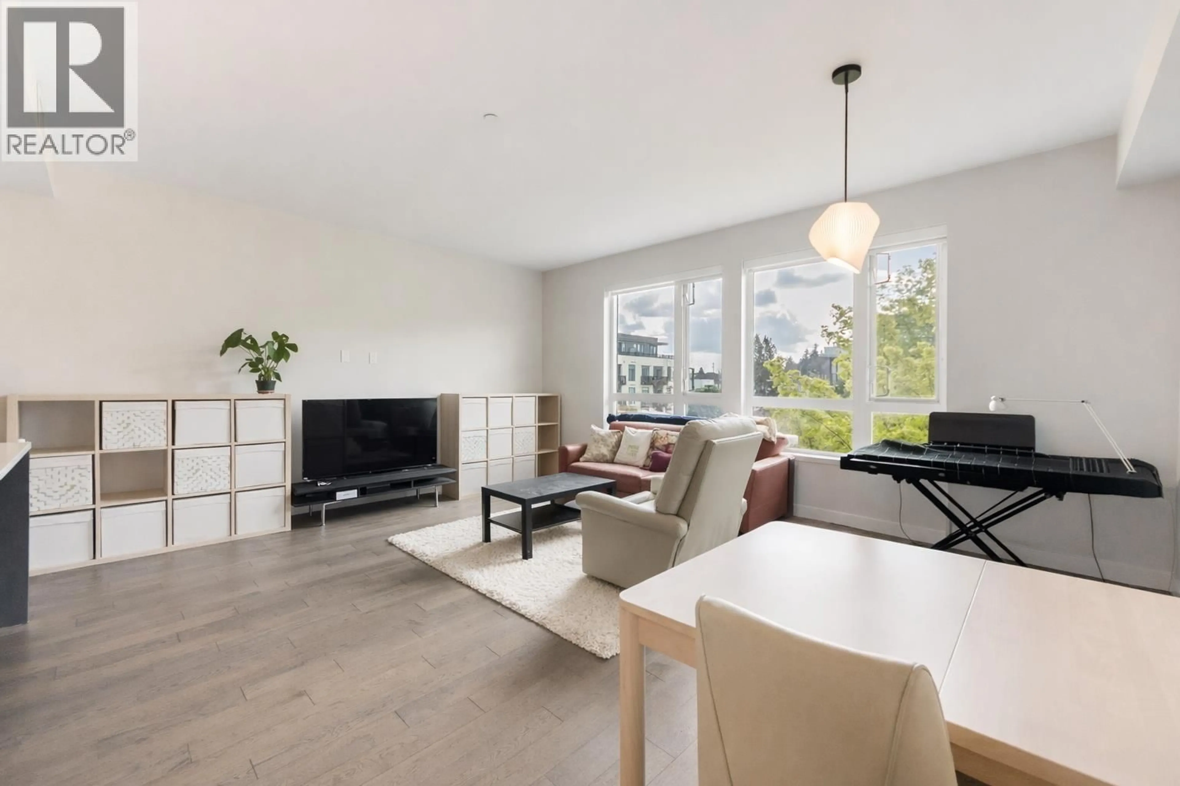 Living room with furniture, wood/laminate floor for 308 - 4080 YUKON STREET, Vancouver British Columbia V5Y0L4