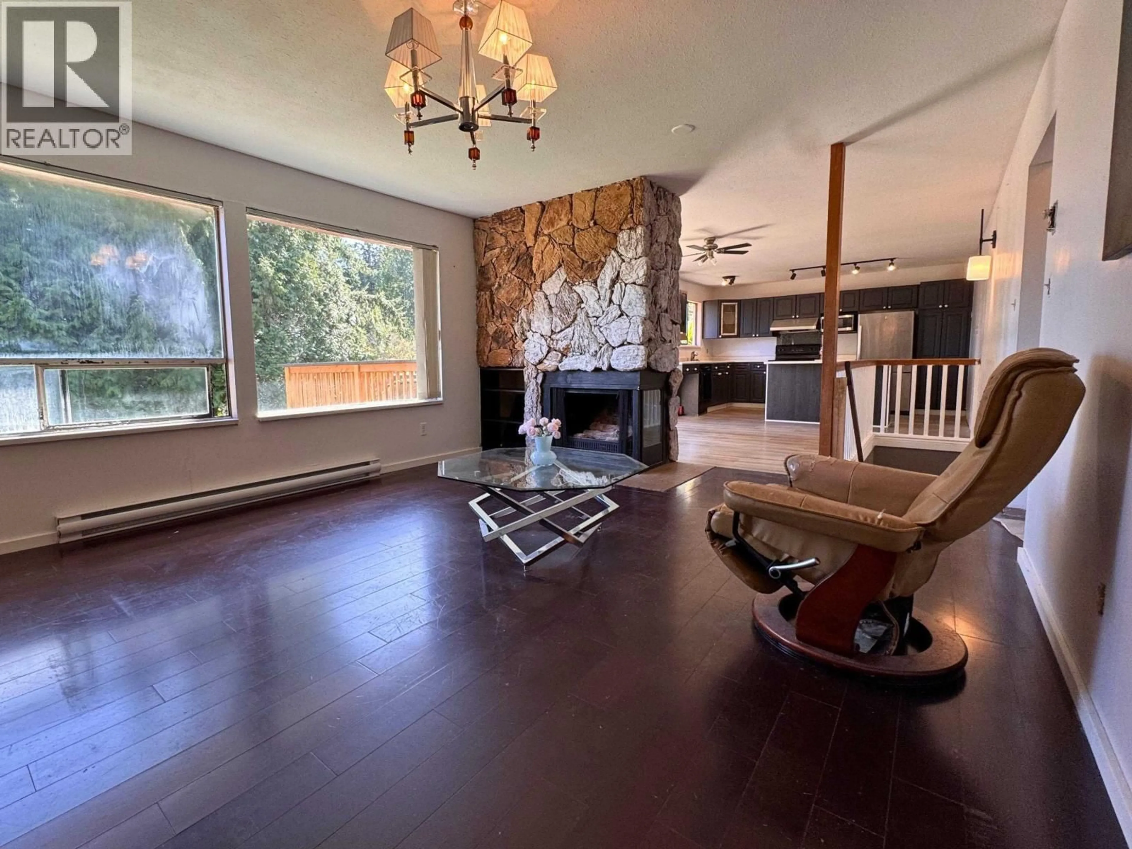 Living room with furniture, wood/laminate floor for 5799 ANCHOR ROAD, Sechelt British Columbia V0N3A0