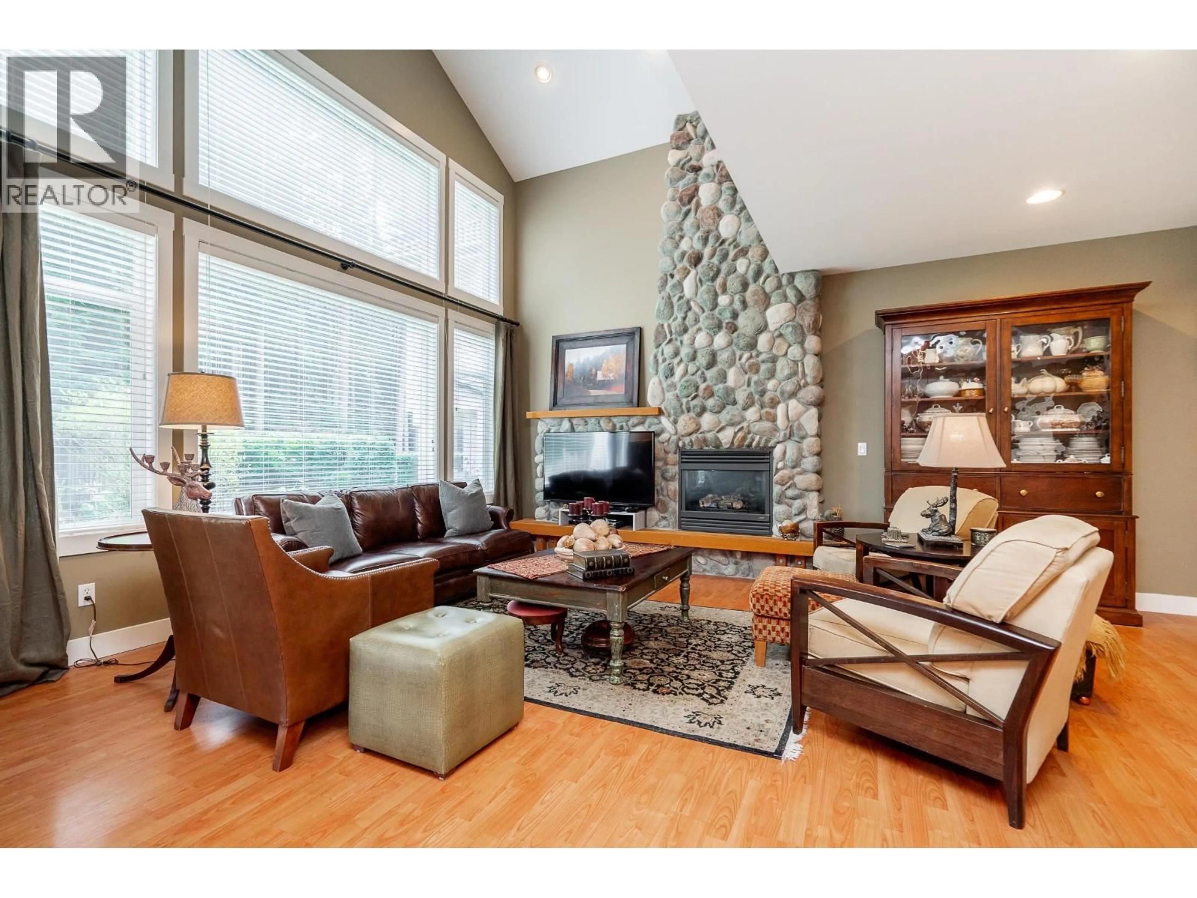 Living room with furniture, wood/laminate floor for 1899 PARKWAY BOULEVARD, Coquitlam British Columbia V3E3L5