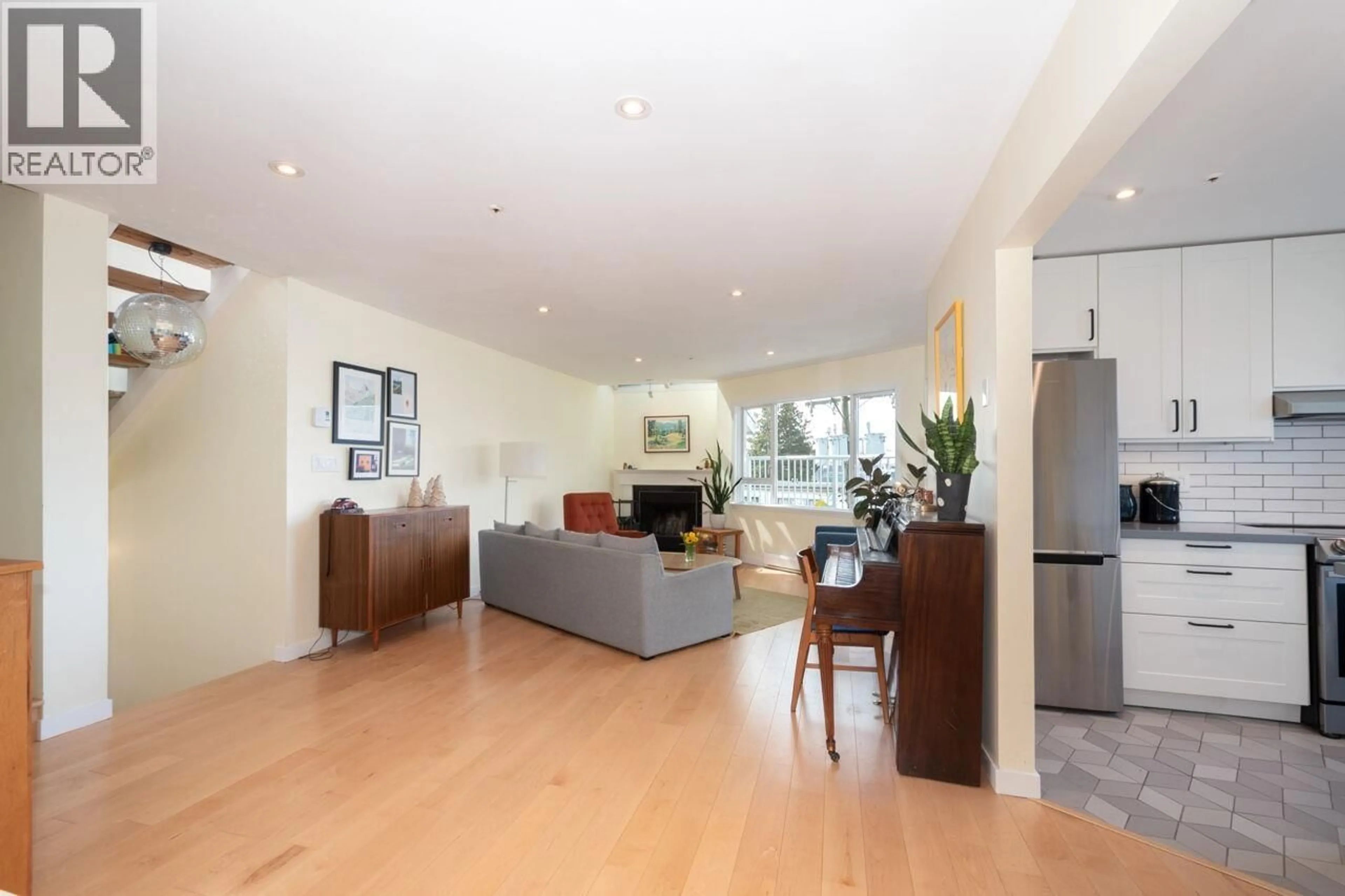 Living room with furniture, wood/laminate floor for 303 - 2215 MCGILL STREET, Vancouver British Columbia V5L1C3