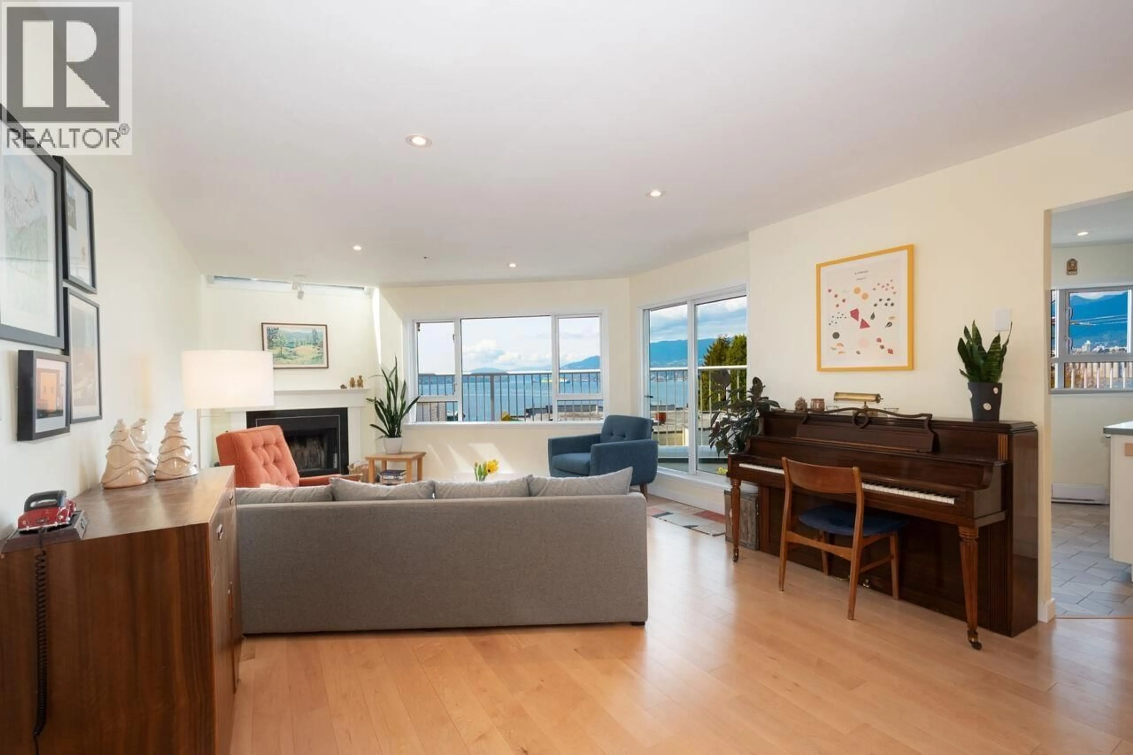 Living room with furniture, wood/laminate floor for 303 - 2215 MCGILL STREET, Vancouver British Columbia V5L1C3