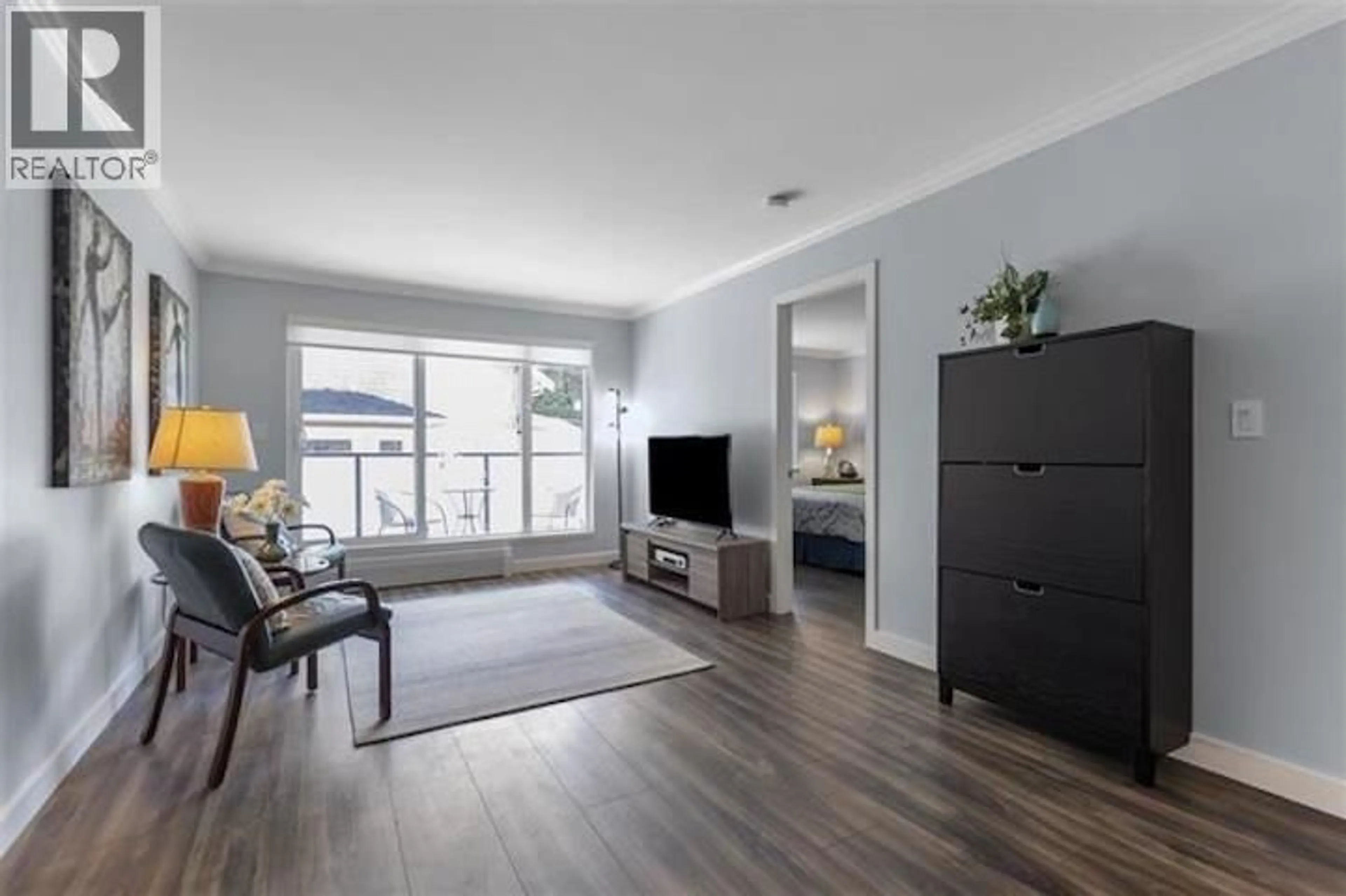 Living room with furniture, wood/laminate floor for 302 - 2328 OXFORD STREET, Vancouver British Columbia V5L1G3