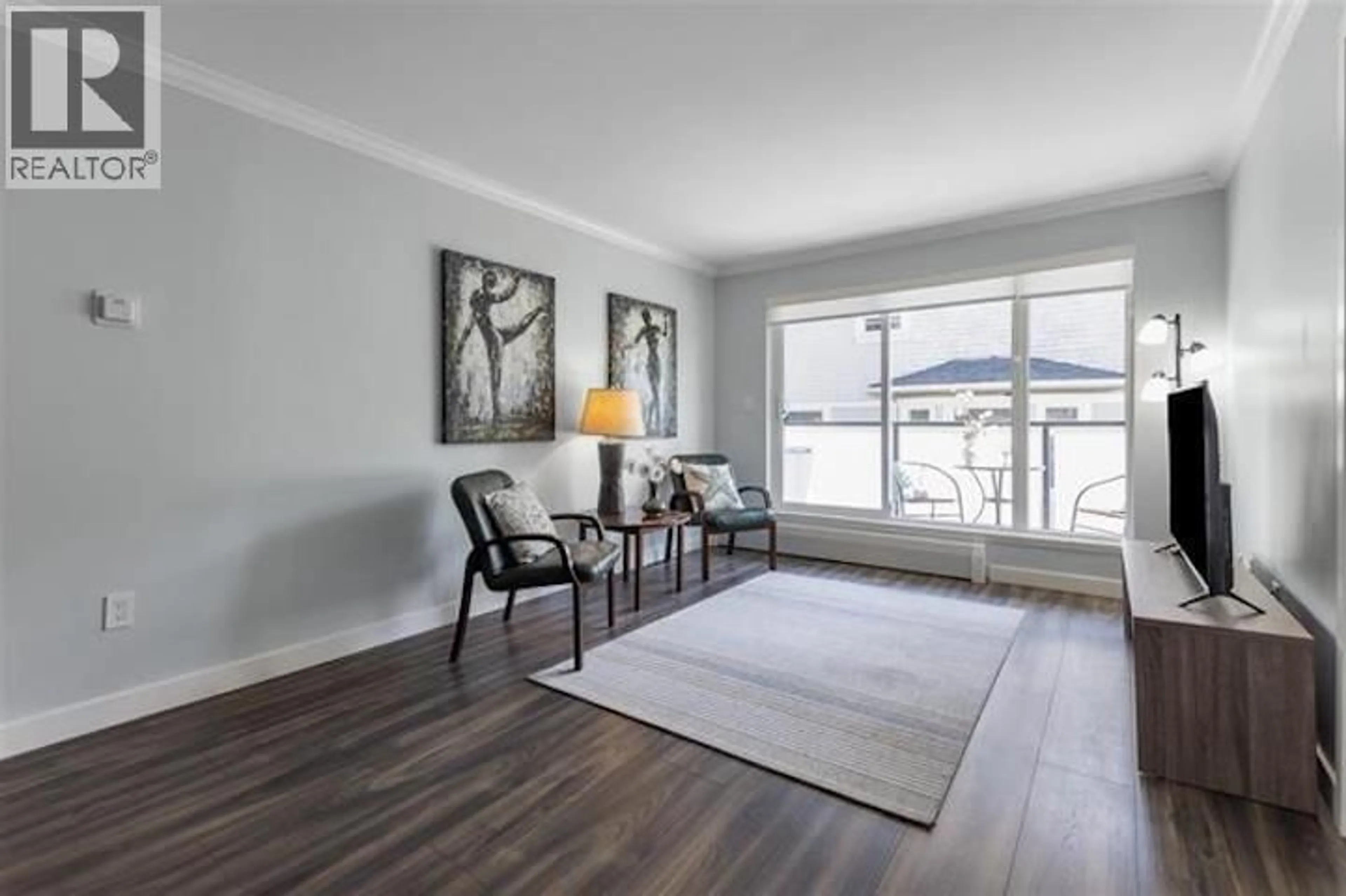 Living room with furniture, wood/laminate floor for 302 - 2328 OXFORD STREET, Vancouver British Columbia V5L1G3