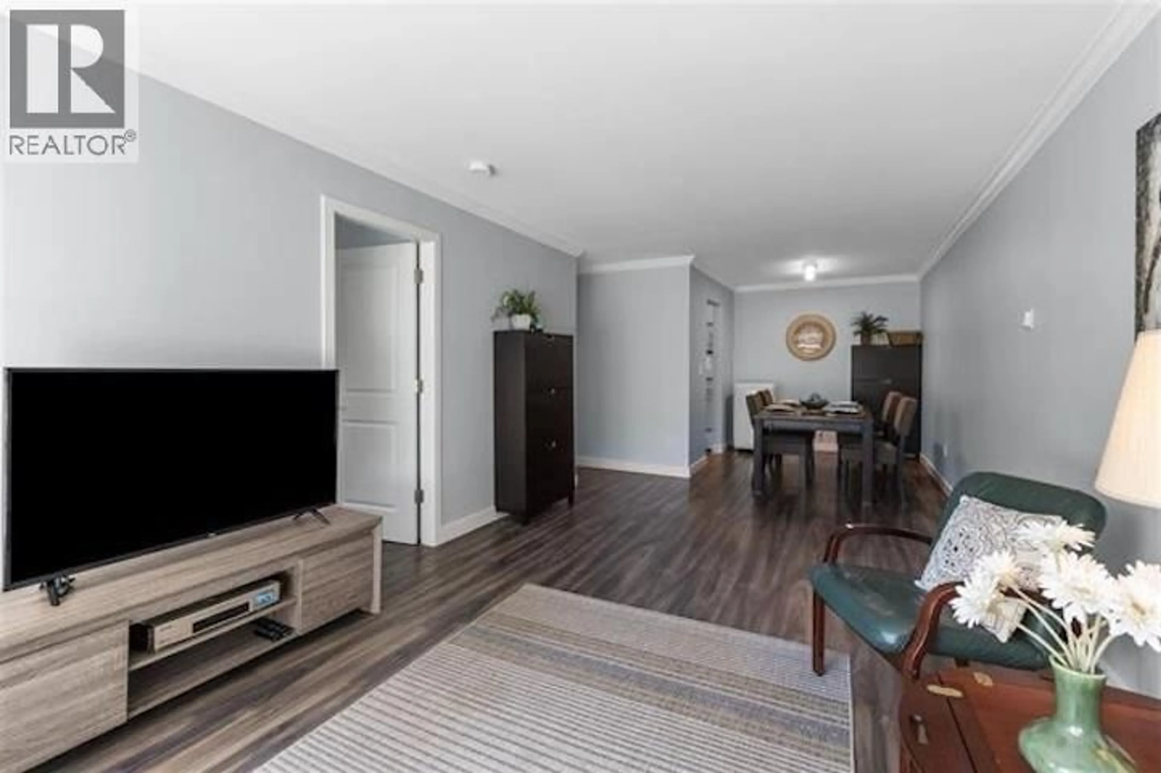 Living room with furniture, wood/laminate floor for 302 - 2328 OXFORD STREET, Vancouver British Columbia V5L1G3