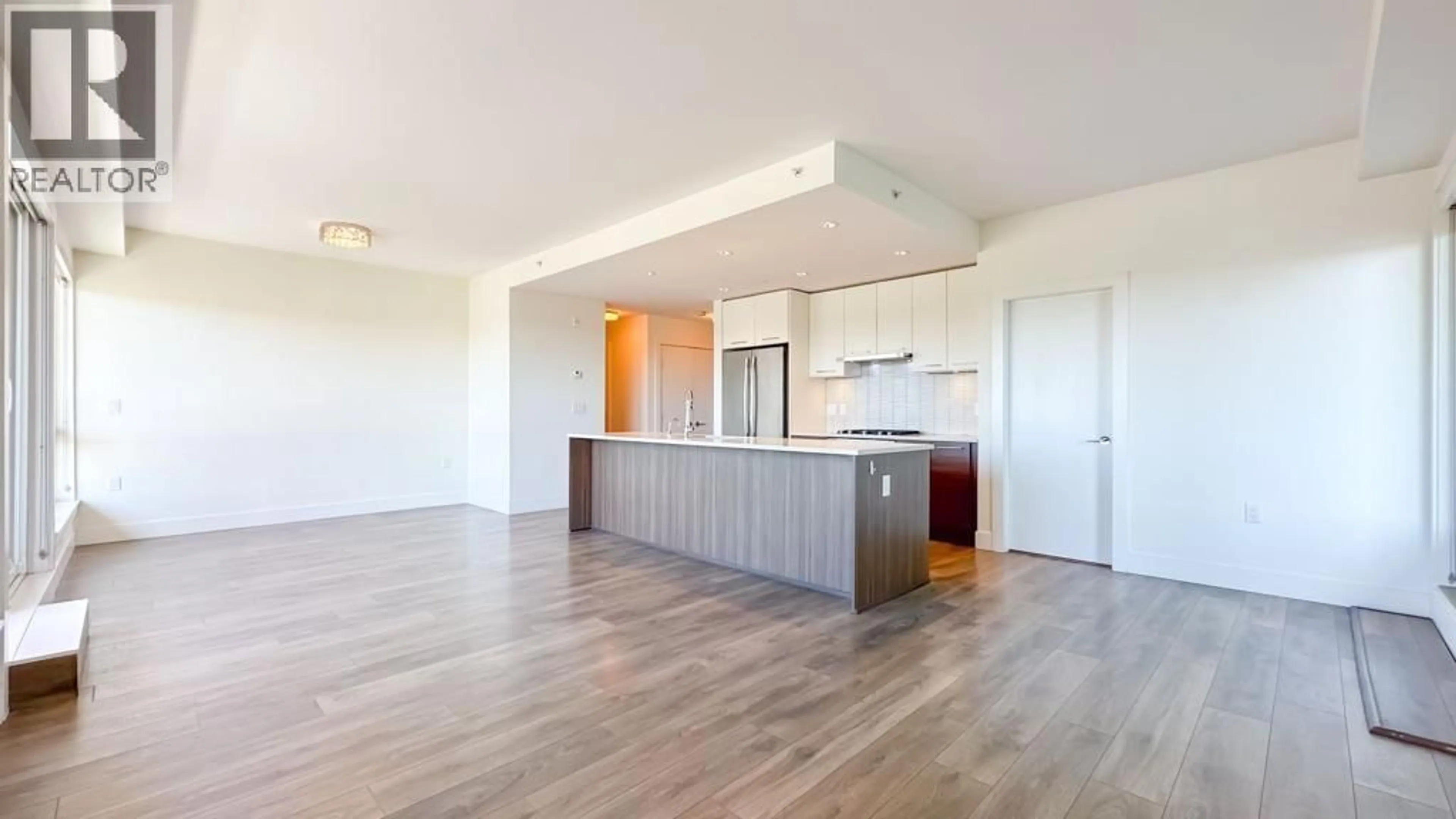 Open concept kitchen, wood/laminate floor for 711 - 8580 RIVER DISTRICT CROSSING, Vancouver British Columbia V5S0B9