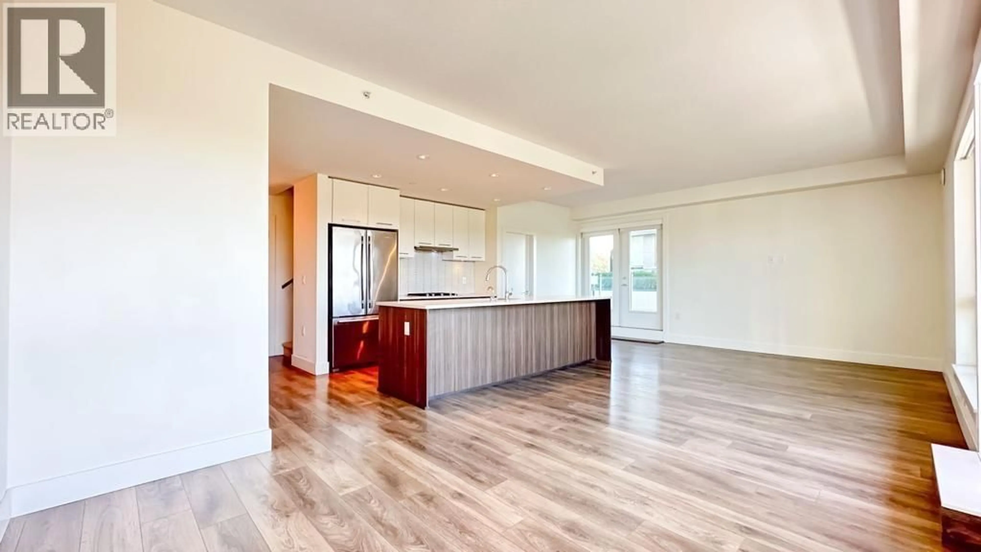 Open concept kitchen, wood/laminate floor for 711 - 8580 RIVER DISTRICT CROSSING, Vancouver British Columbia V5S0B9