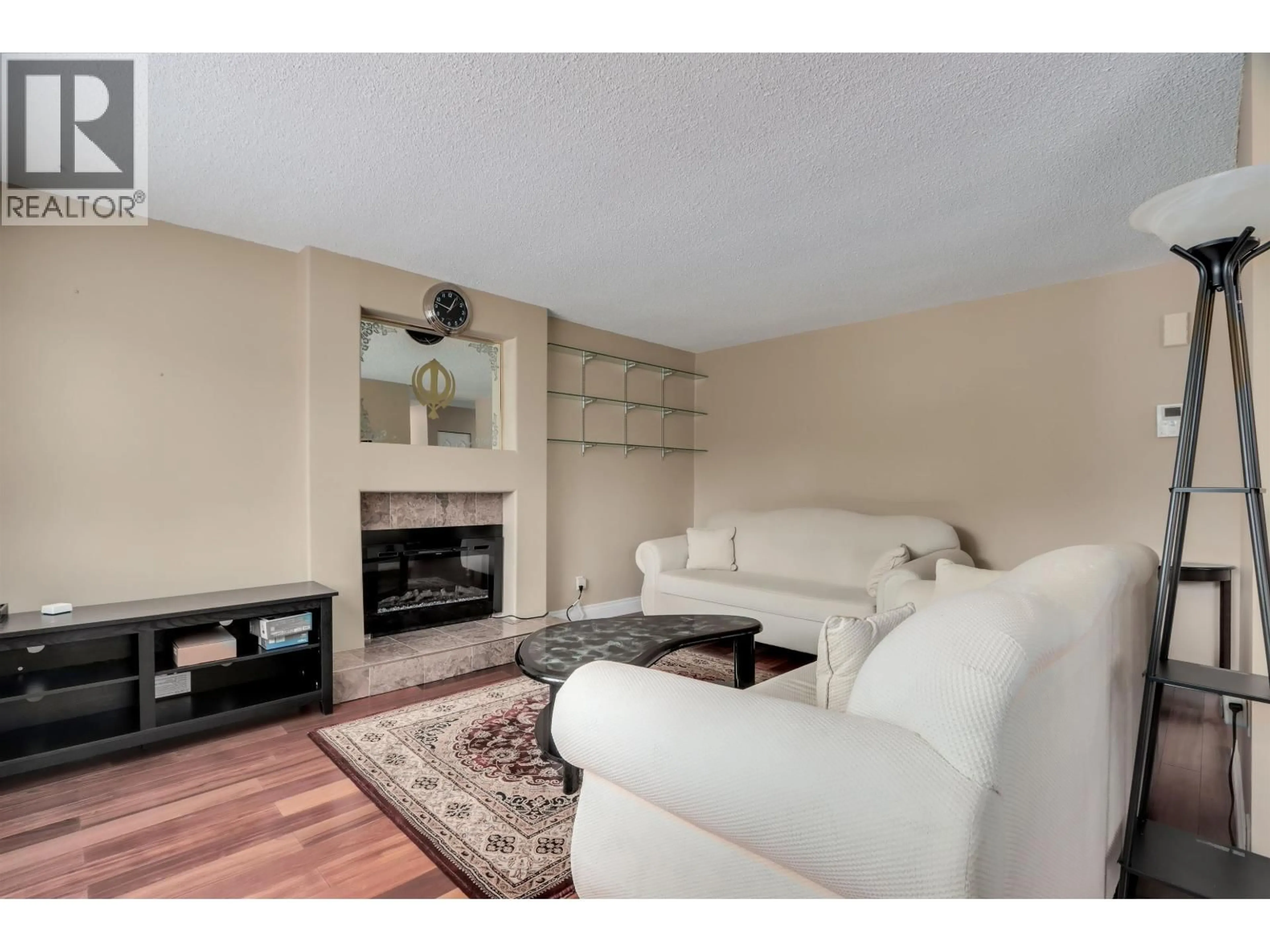Living room with furniture, wood/laminate floor for 6525 DENBIGH AVENUE, Burnaby British Columbia V5H3R7