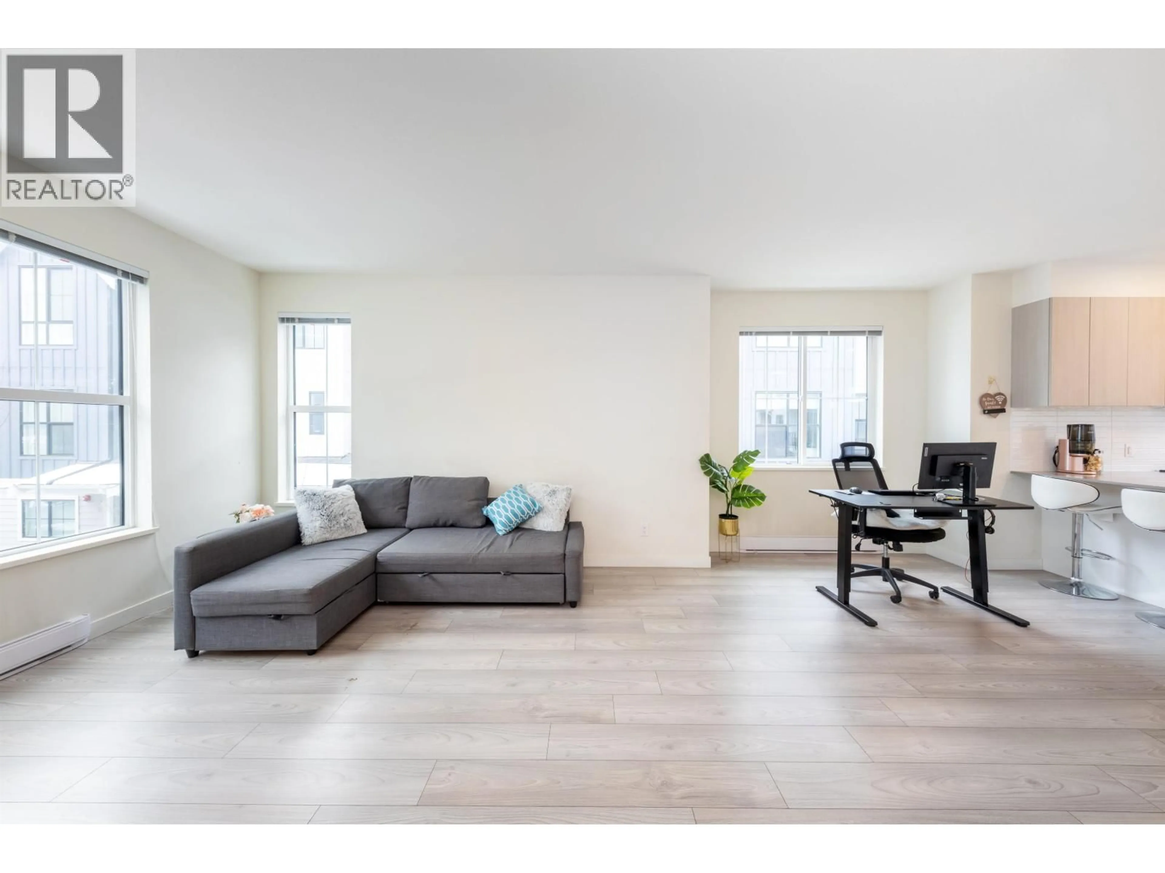 Living room with furniture, wood/laminate floor for 123 - 488 FURNESS STREET, New Westminster British Columbia V3M0M1