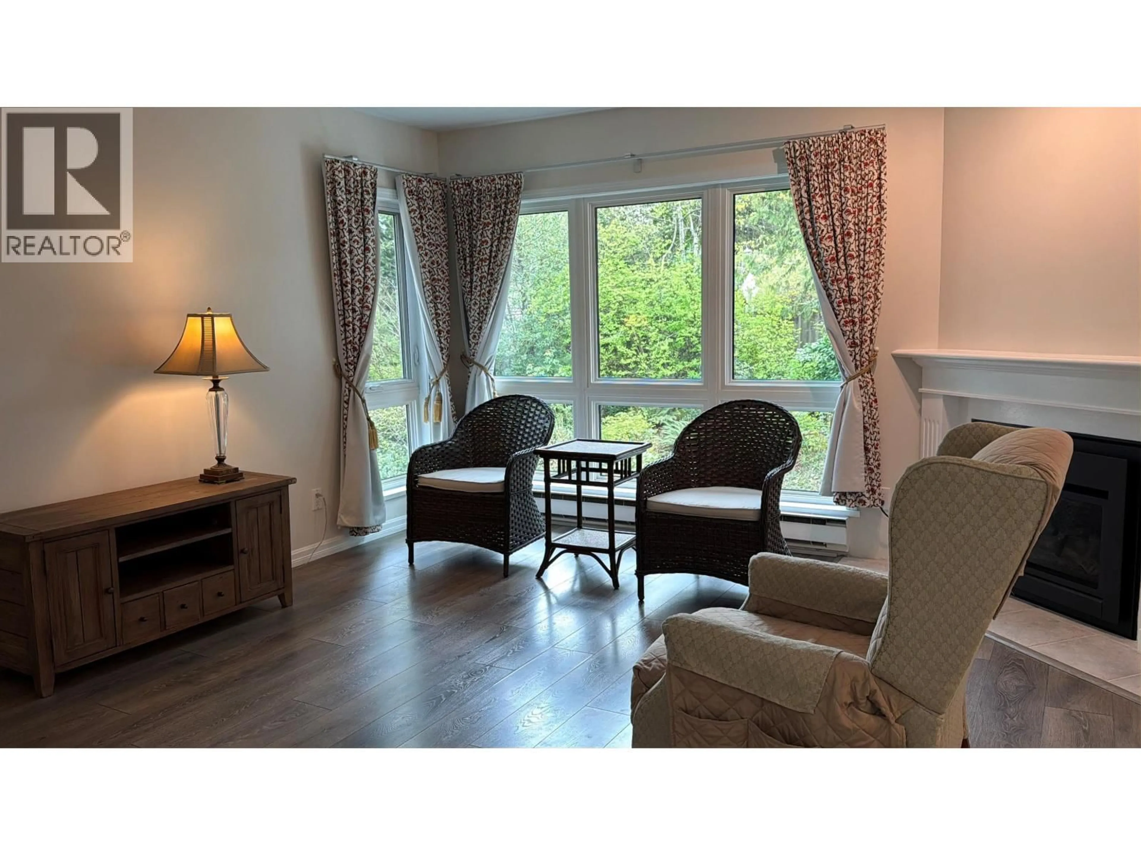 Living room with furniture, wood/laminate floor for 402 - 3970 LINWOOD STREET, Burnaby British Columbia V5G4R5