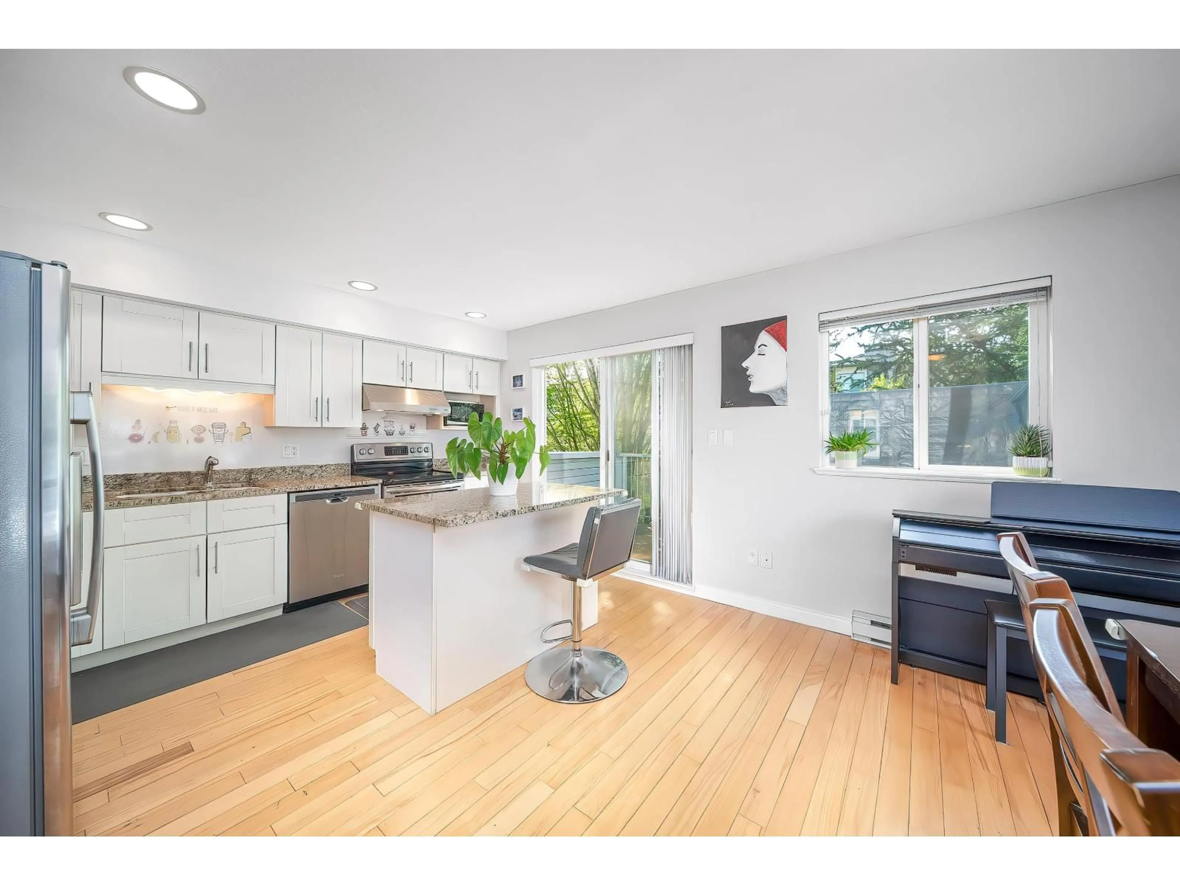 Open concept kitchen, wood/laminate floor for 1 - 16388 85 AVENUE, Surrey British Columbia V4N5G2