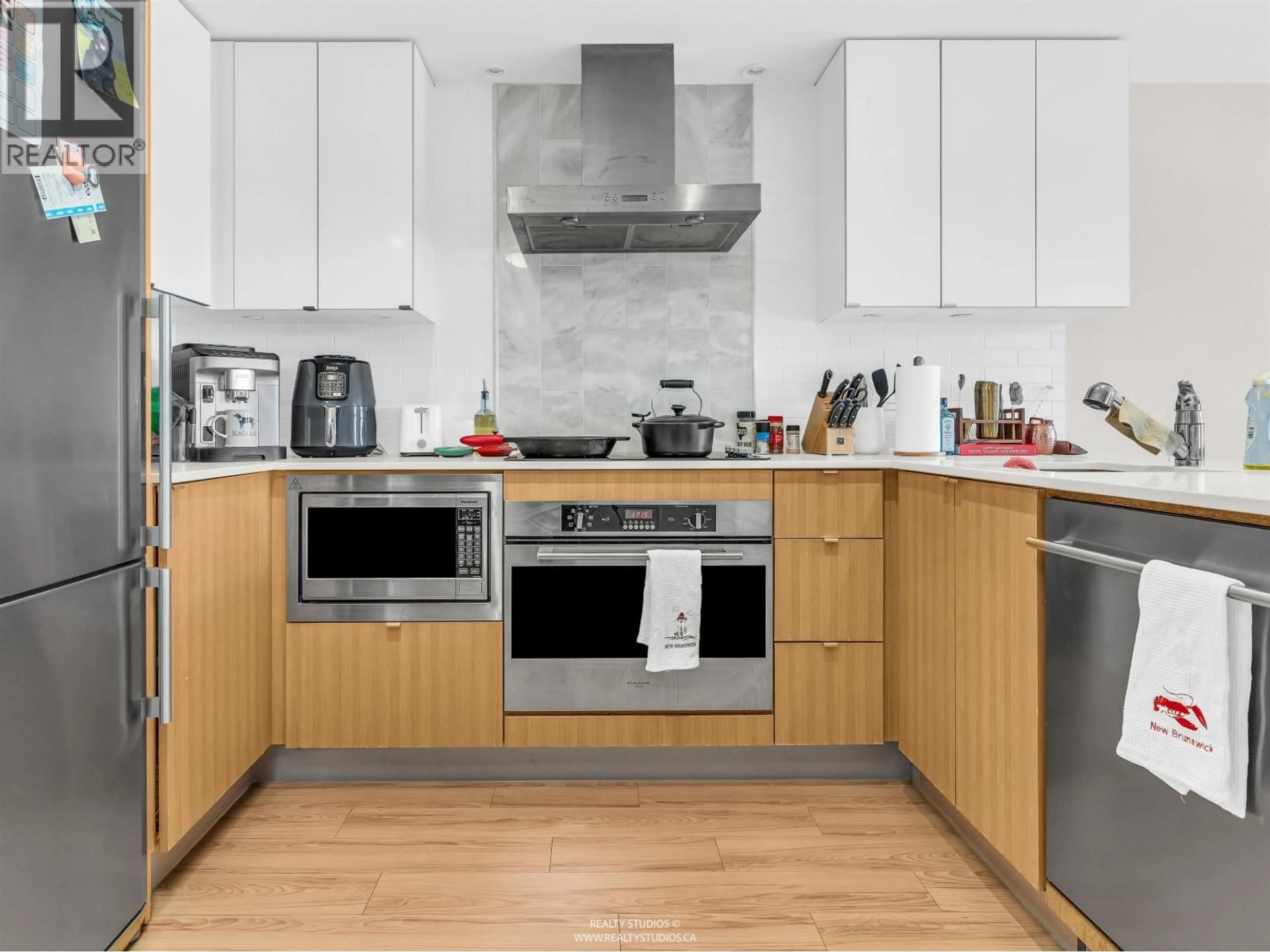 Contemporary kitchen, wood/laminate floor for 710 - 159 2ND AVENUE, Vancouver British Columbia V5Y0L8